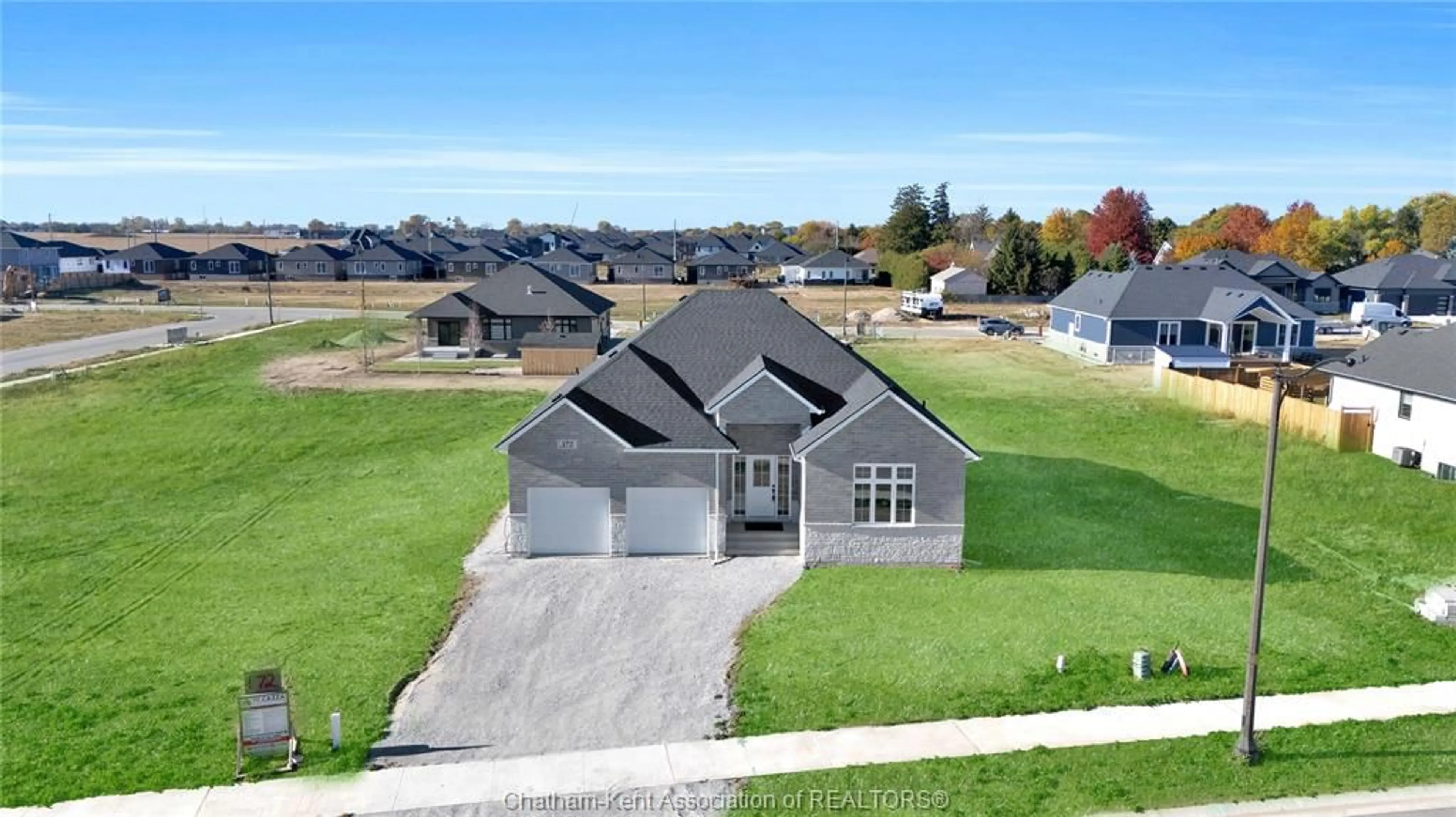 A pic from outside/outdoor area/front of a property/back of a property/a pic from drone, street for 172 Rosewood Cres, Chatham Ontario N7M 0V4