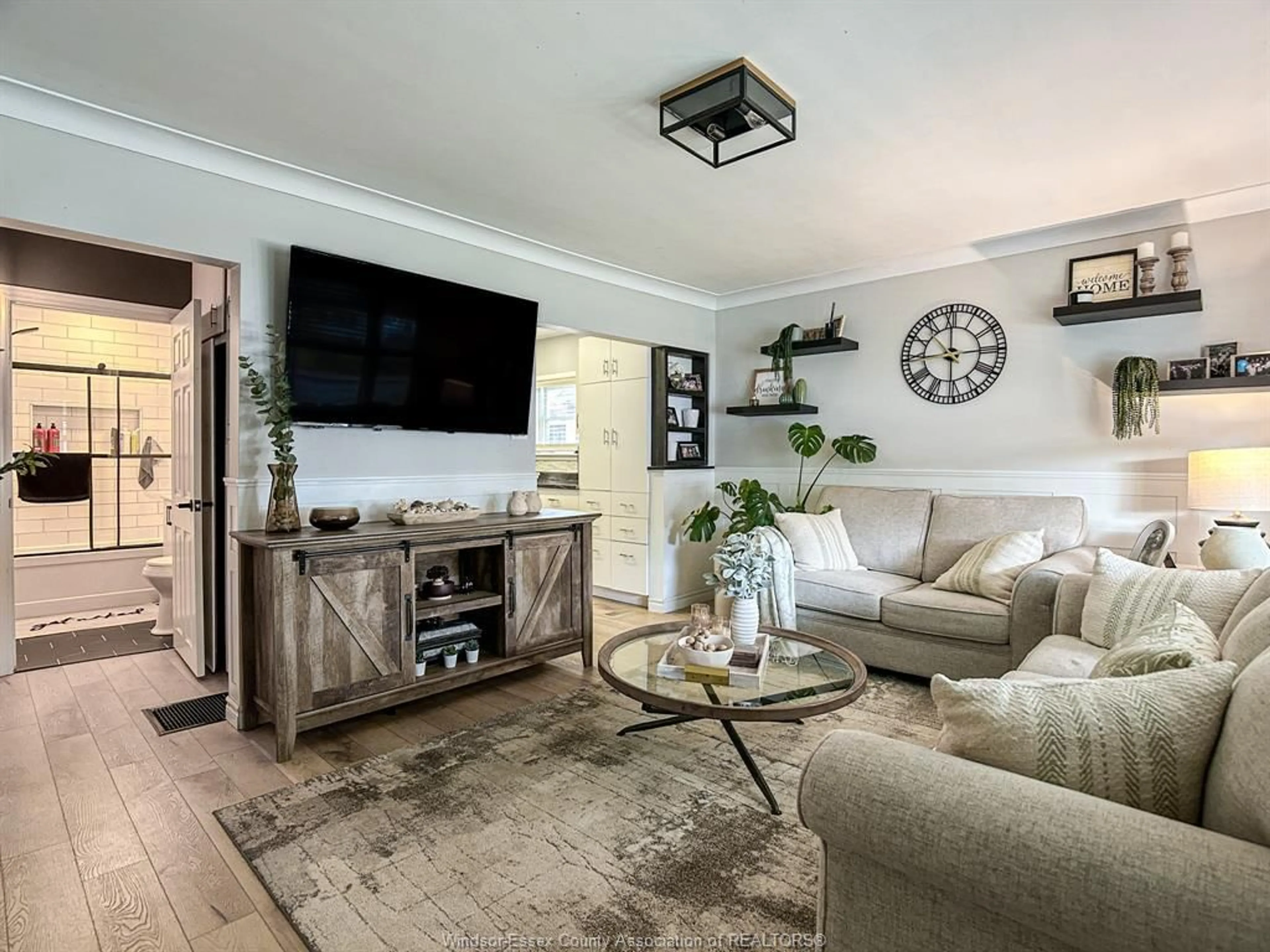 Living room with furniture, wood/laminate floor for 1689 CENTRAL Ave, Windsor Ontario N8Y 3V9