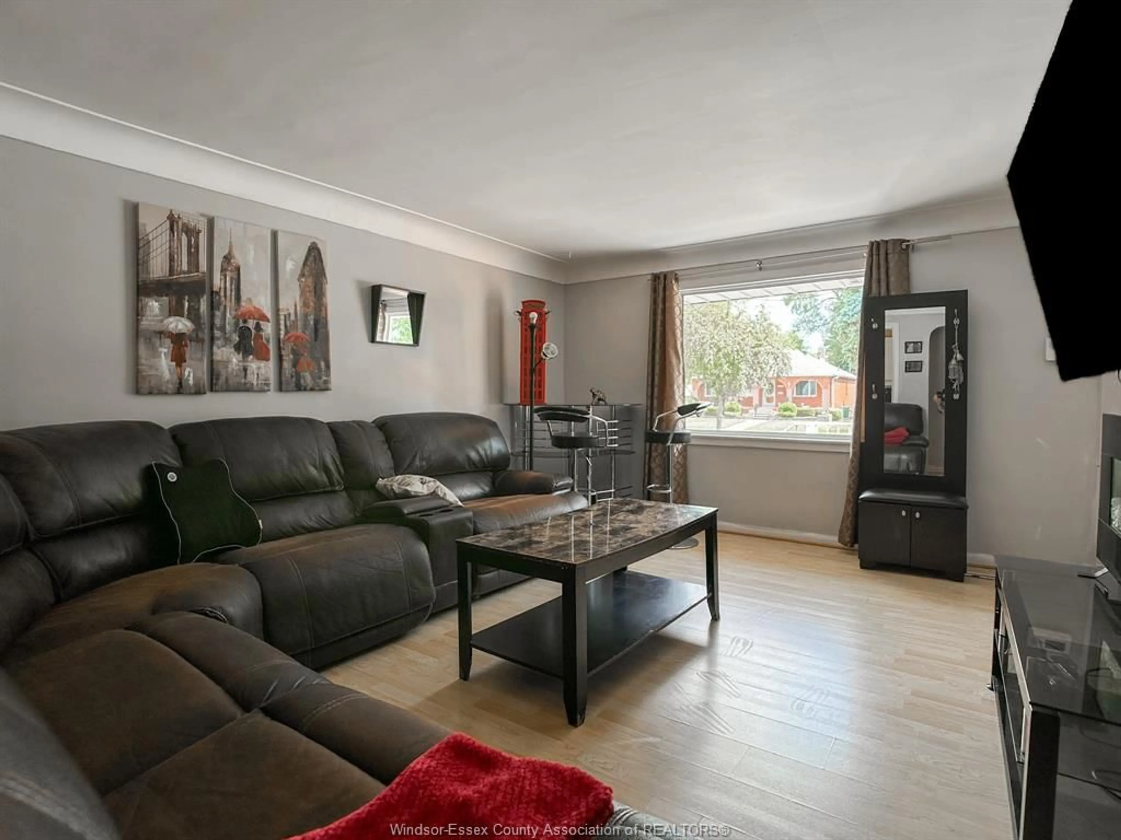 Living room with furniture, wood/laminate floor for 2509 ROSSINI, Windsor Ontario N8W 4R2