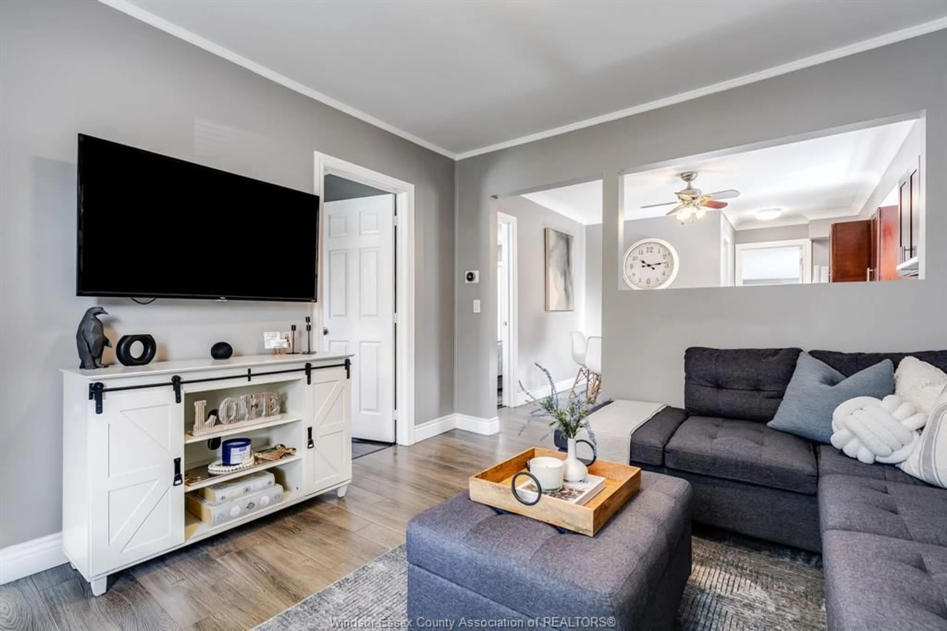 Living room with furniture, wood/laminate floor for 2408 George Ave, Windsor Ontario N8W 4M5