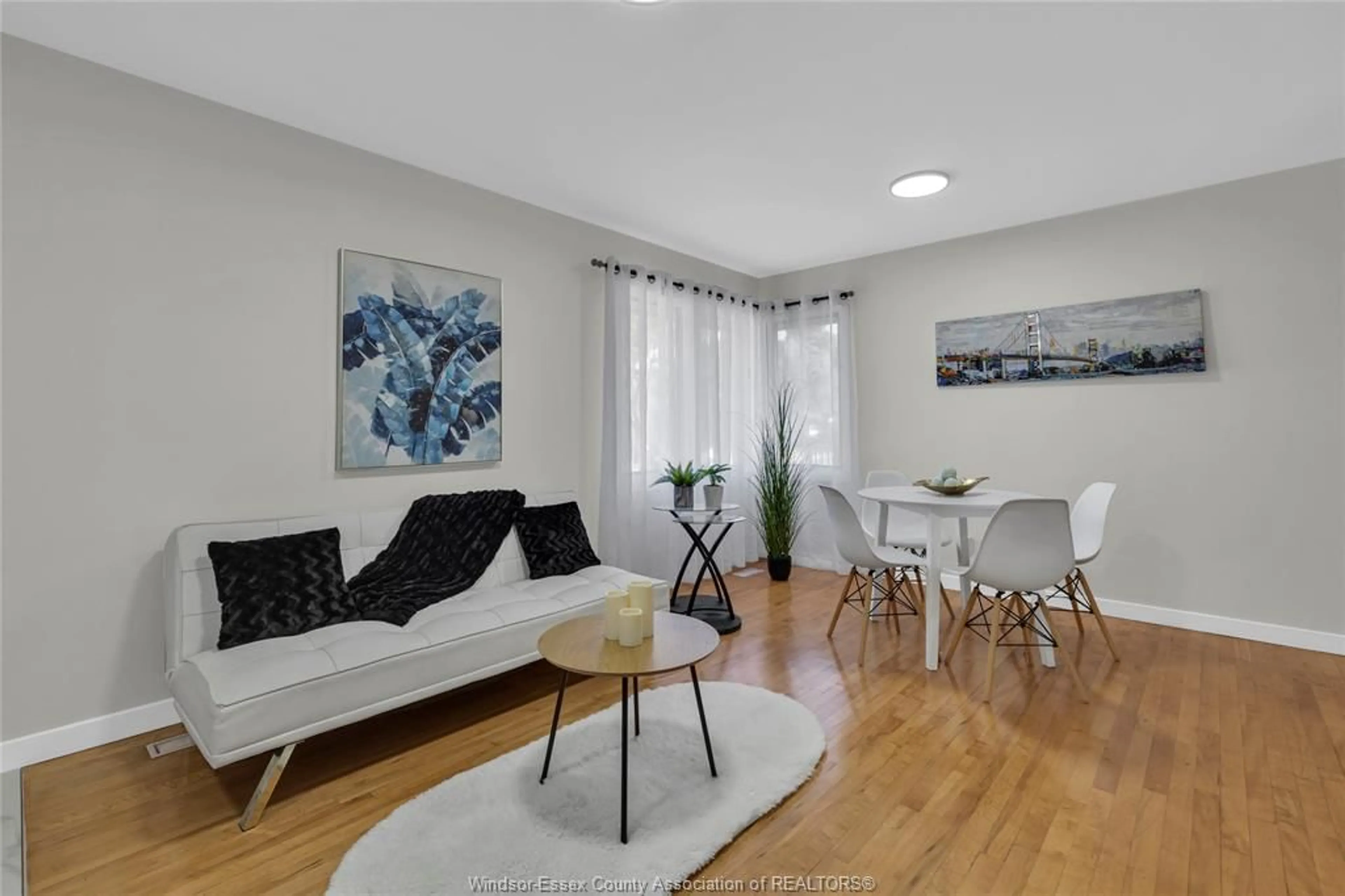 Living room with furniture, wood/laminate floor for 847 FRANCOIS Crt, Windsor Ontario N8Y 3W5