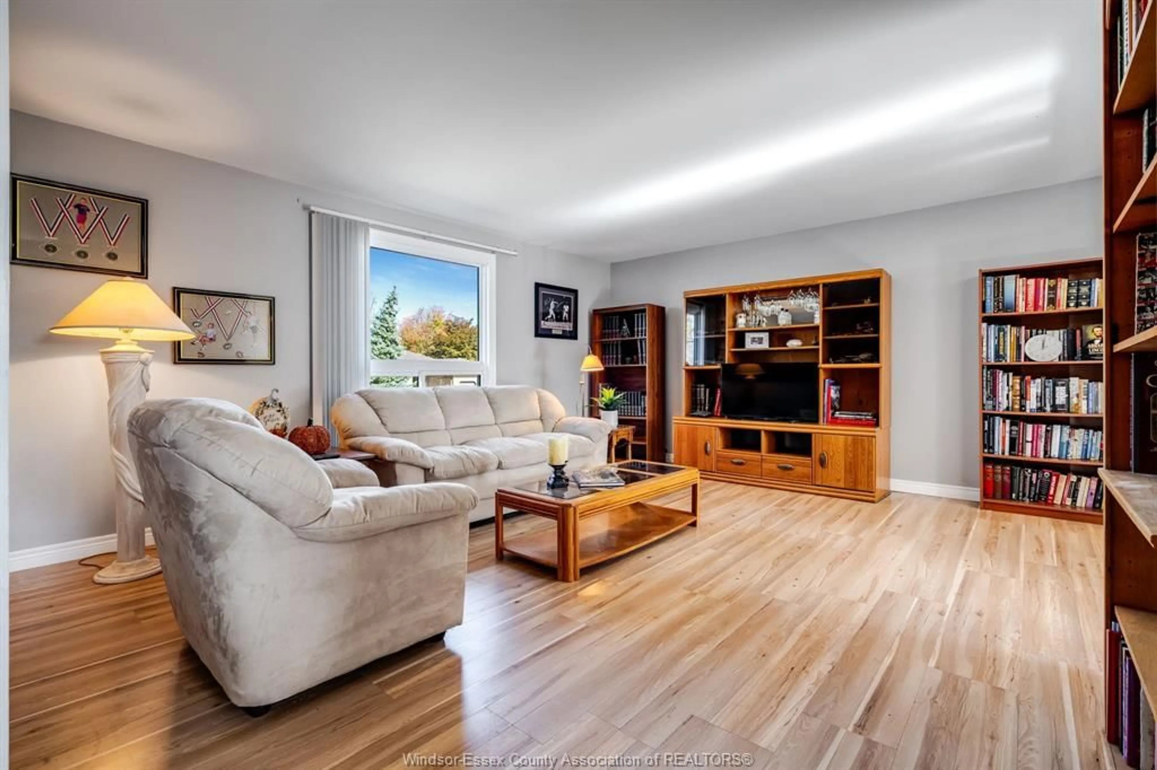 Living room with furniture, wood/laminate floor for 1587 Oakwood, Lakeshore Ontario N8L 1C8