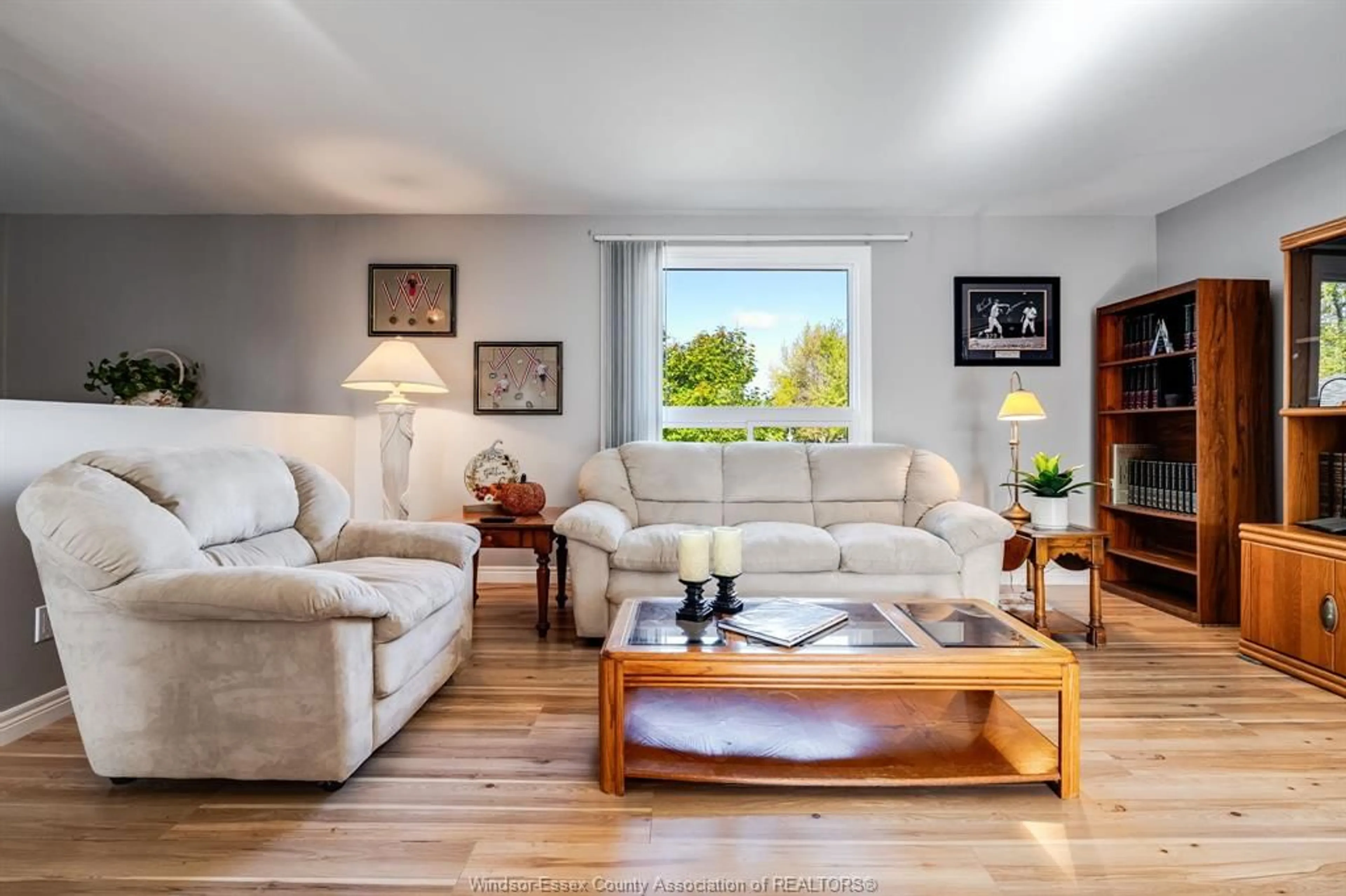 Living room with furniture, wood/laminate floor for 1587 Oakwood, Lakeshore Ontario N8L 1C8