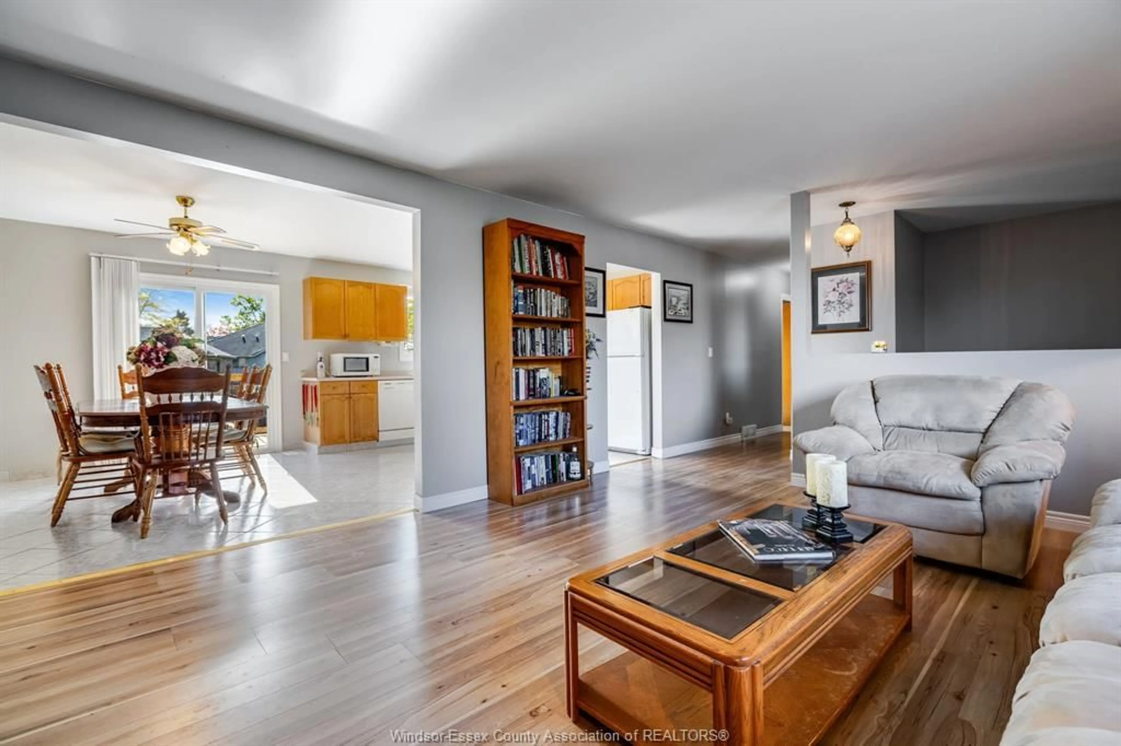 Living room with furniture, wood/laminate floor for 1587 Oakwood, Lakeshore Ontario N8L 1C8