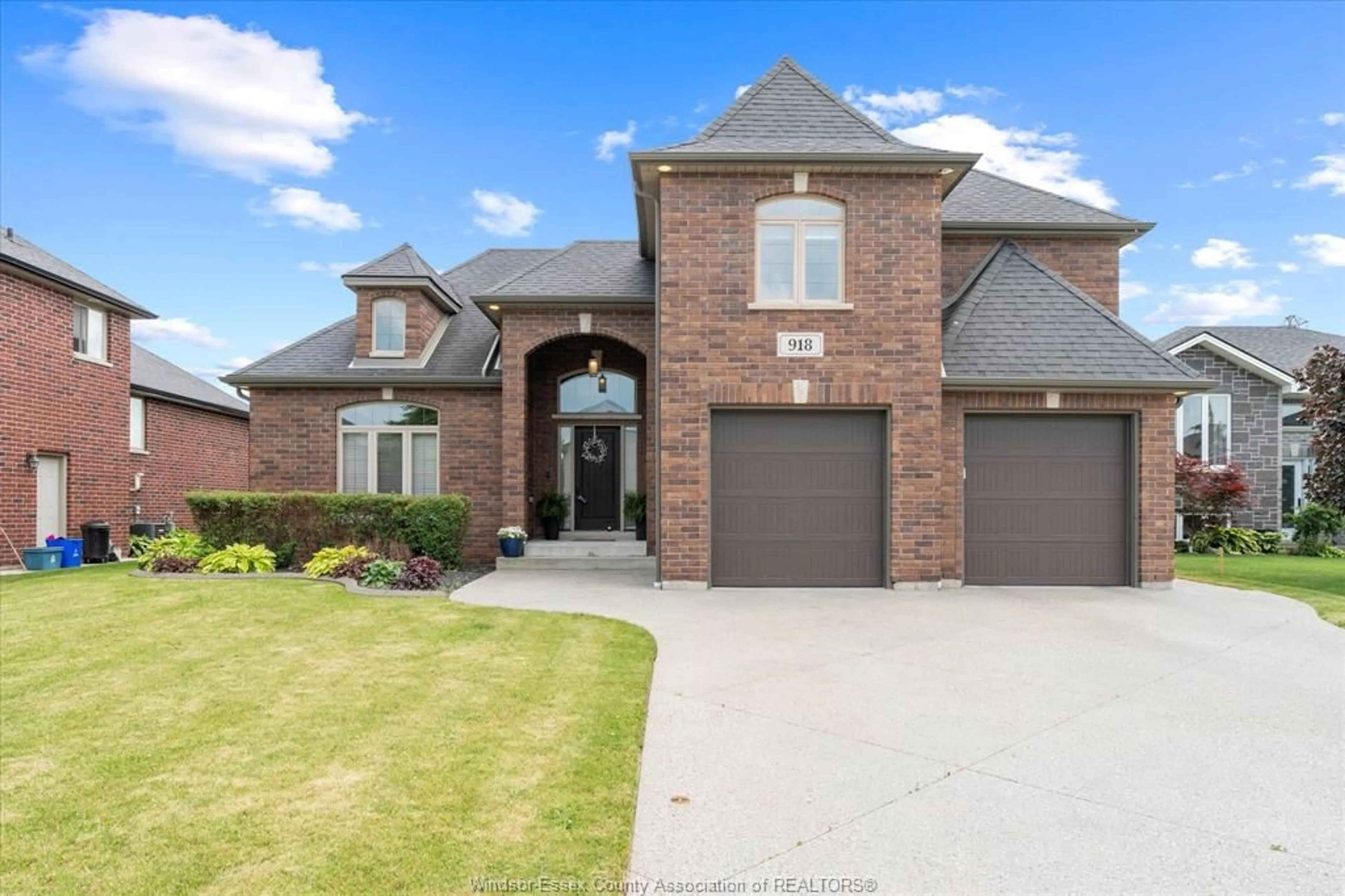 Home with brick exterior material, street for 918 DRIFTWOOD Cres, Lakeshore Ontario N0R 1A0