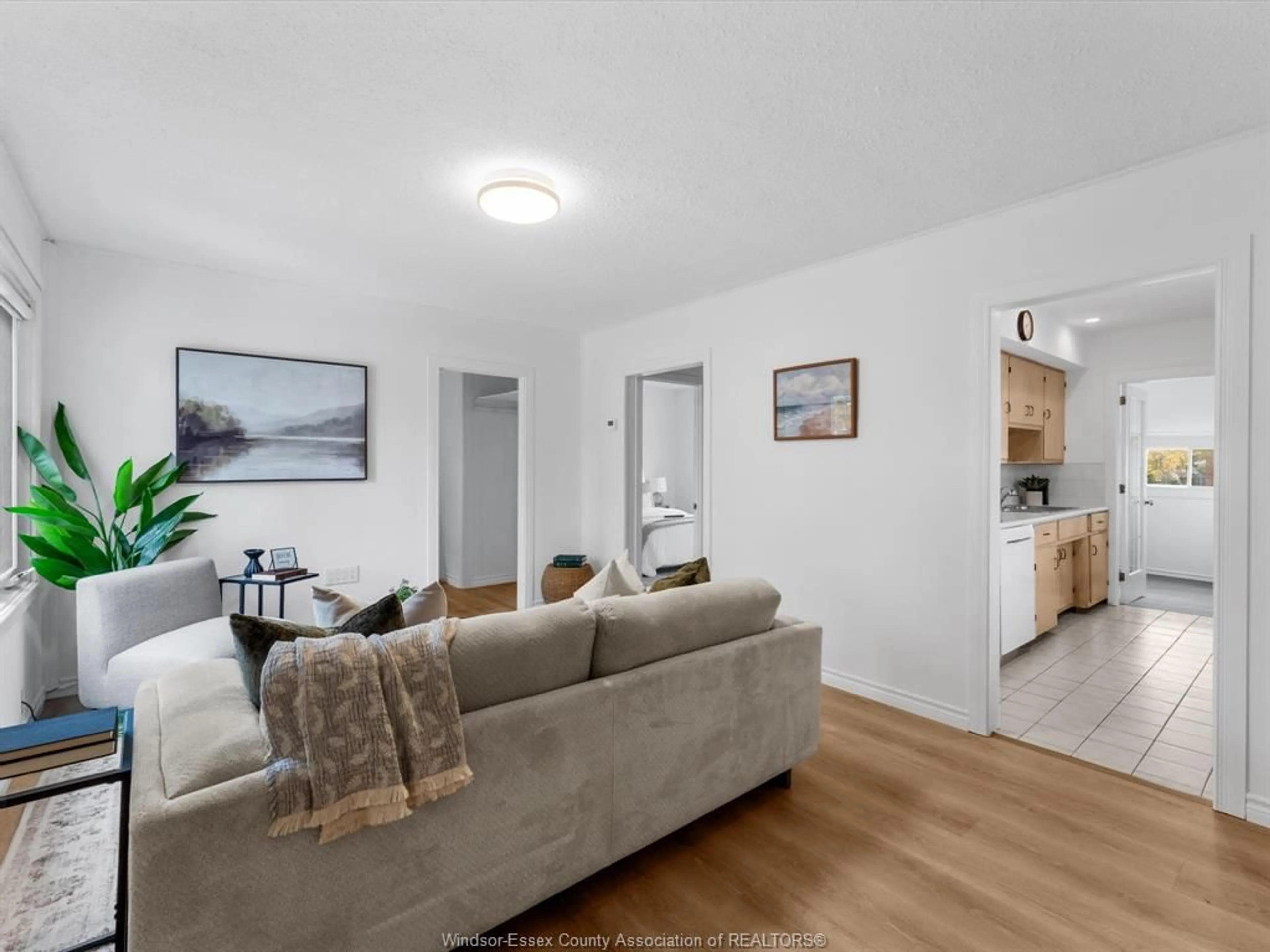 Living room with furniture, wood/laminate floor for 1765 ALBERT Rd, Windsor Ontario N8Y 3R6