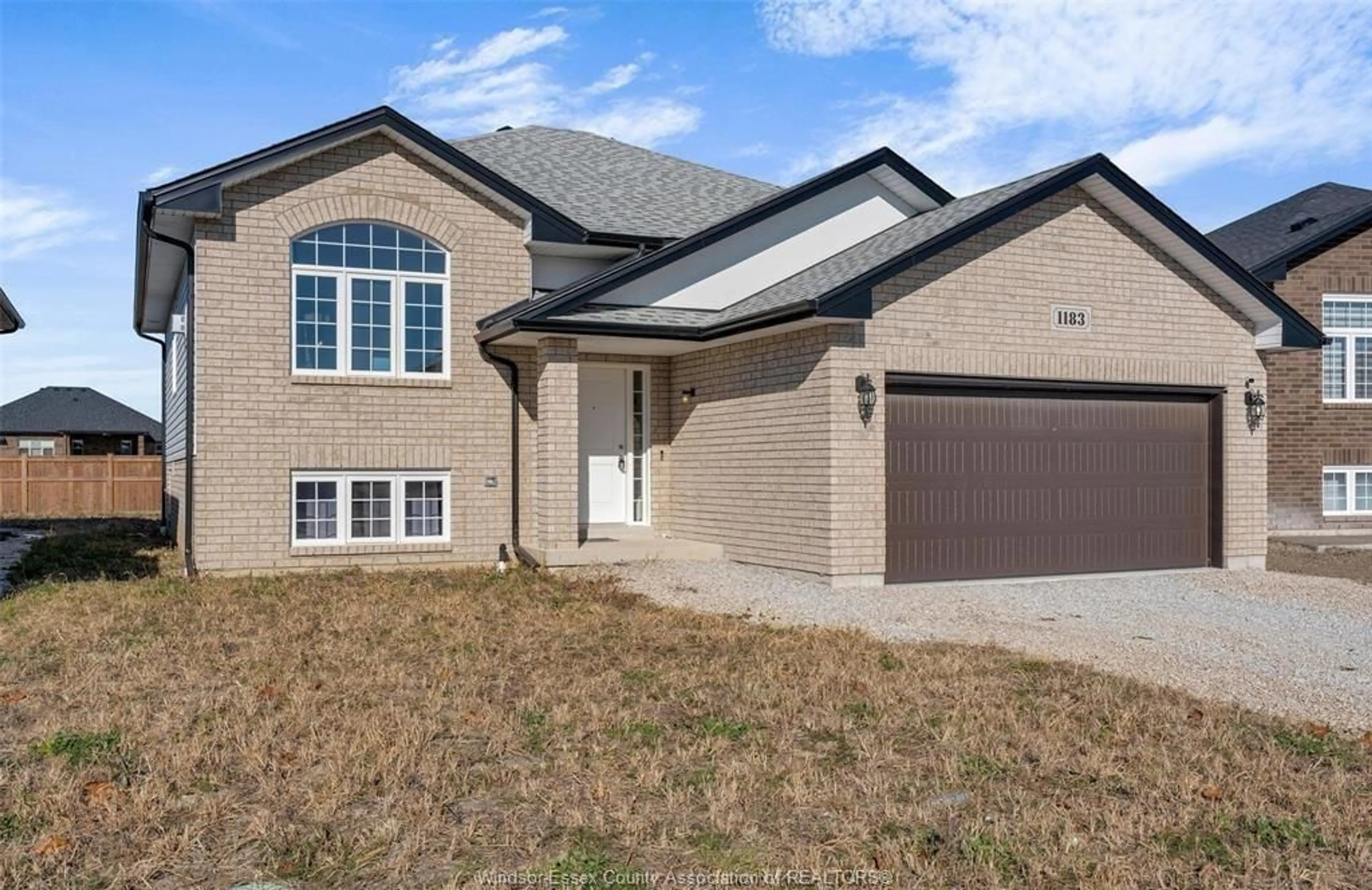 Home with brick exterior material, street for 1183 ASPEN RIDGE Cres, Lakeshore Ontario N0R 1A0