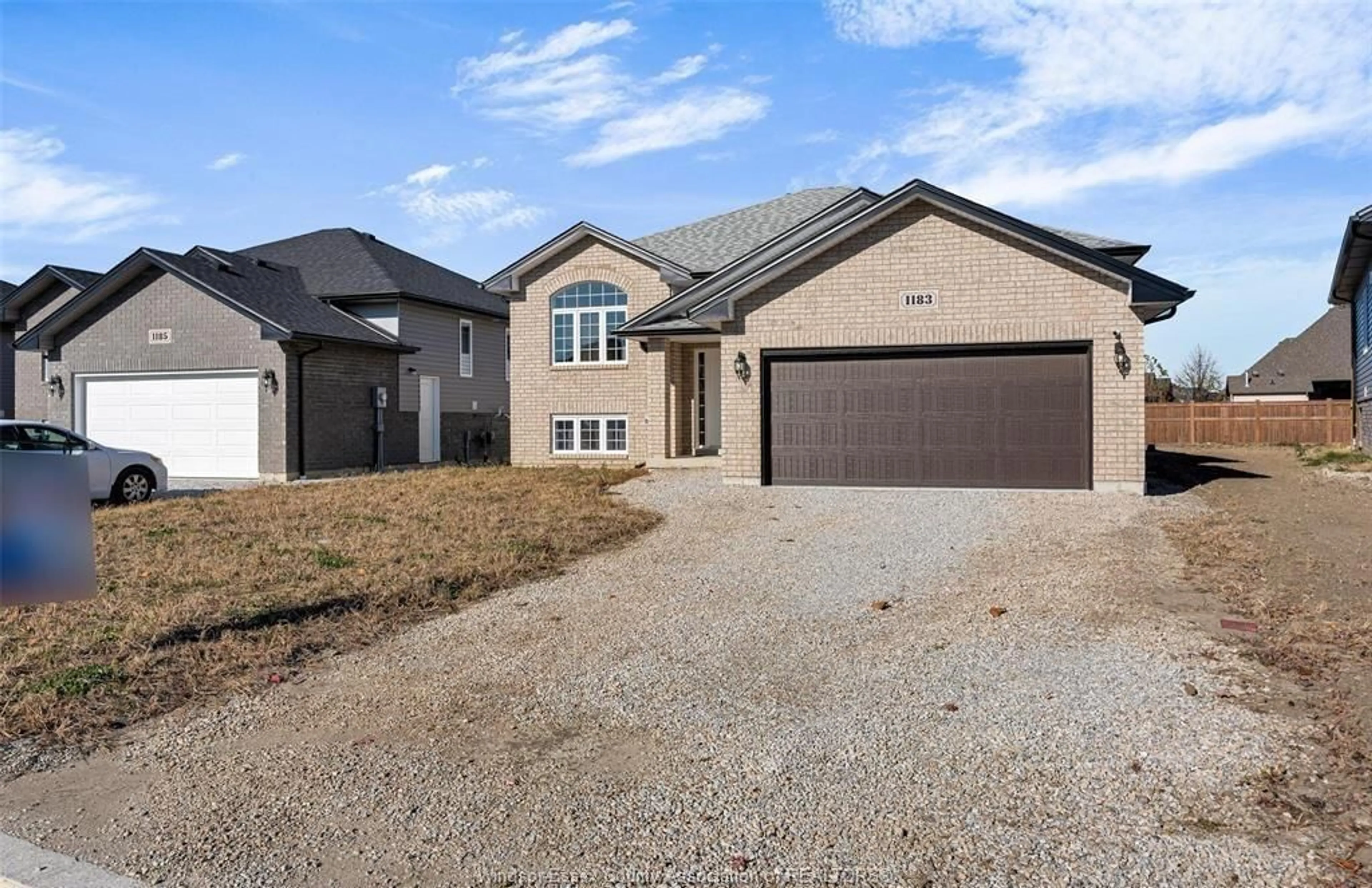 Home with brick exterior material, street for 1183 ASPEN RIDGE Cres, Lakeshore Ontario N0R 1A0