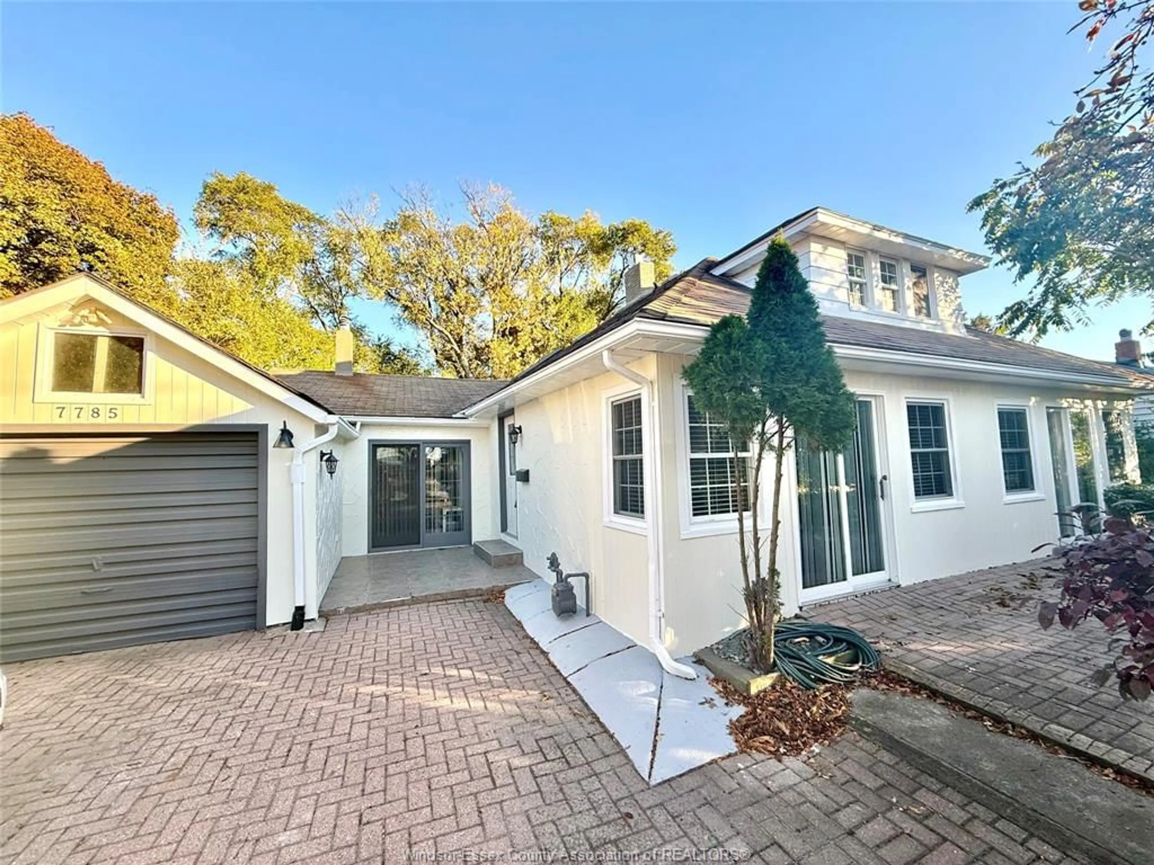 Home with vinyl exterior material, street for 7785 RIVERSIDE Dr, Windsor Ontario N8S 1E1