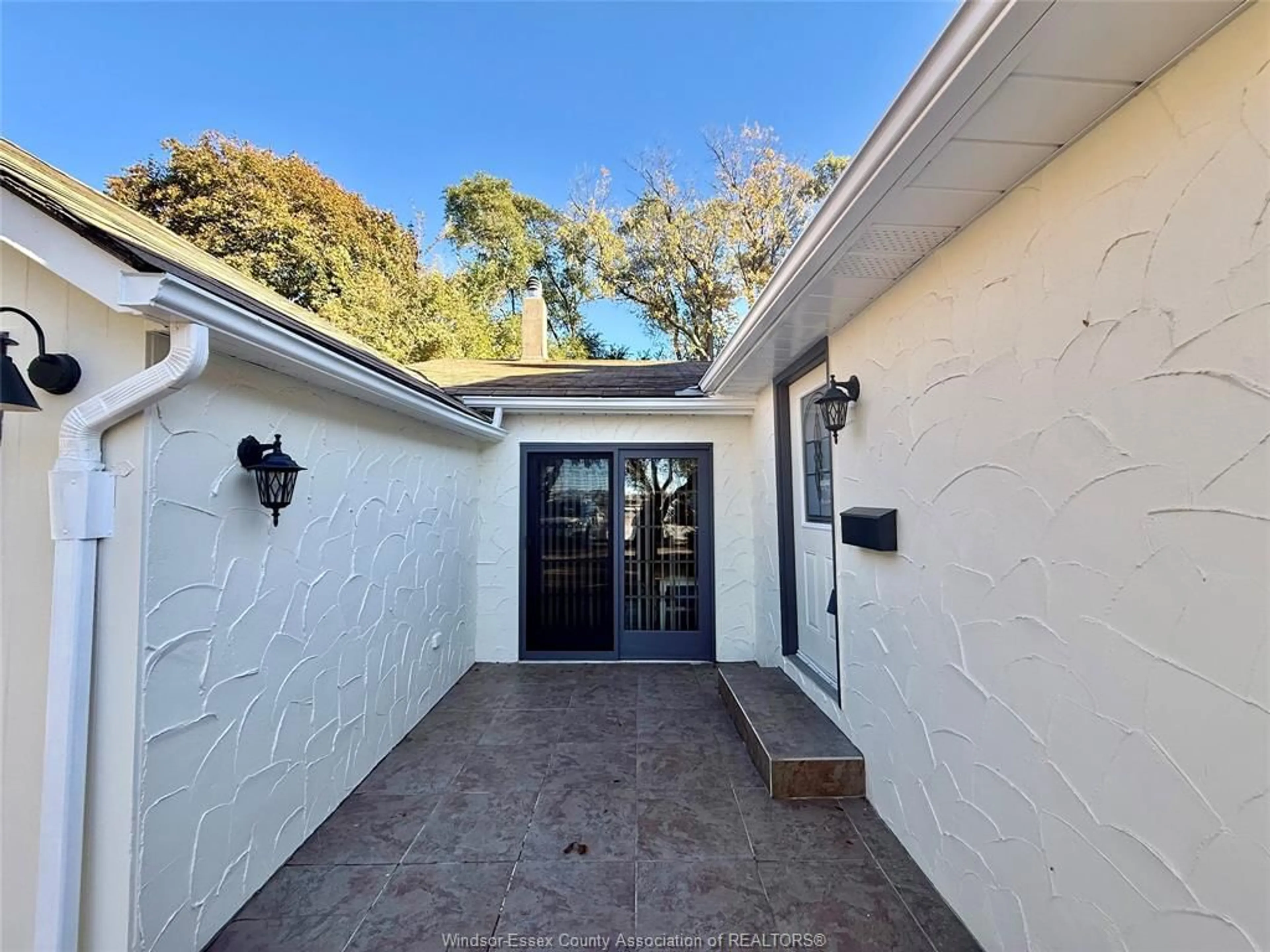 A pic from outside/outdoor area/front of a property/back of a property/a pic from drone, street for 7785 RIVERSIDE Dr, Windsor Ontario N8S 1E1