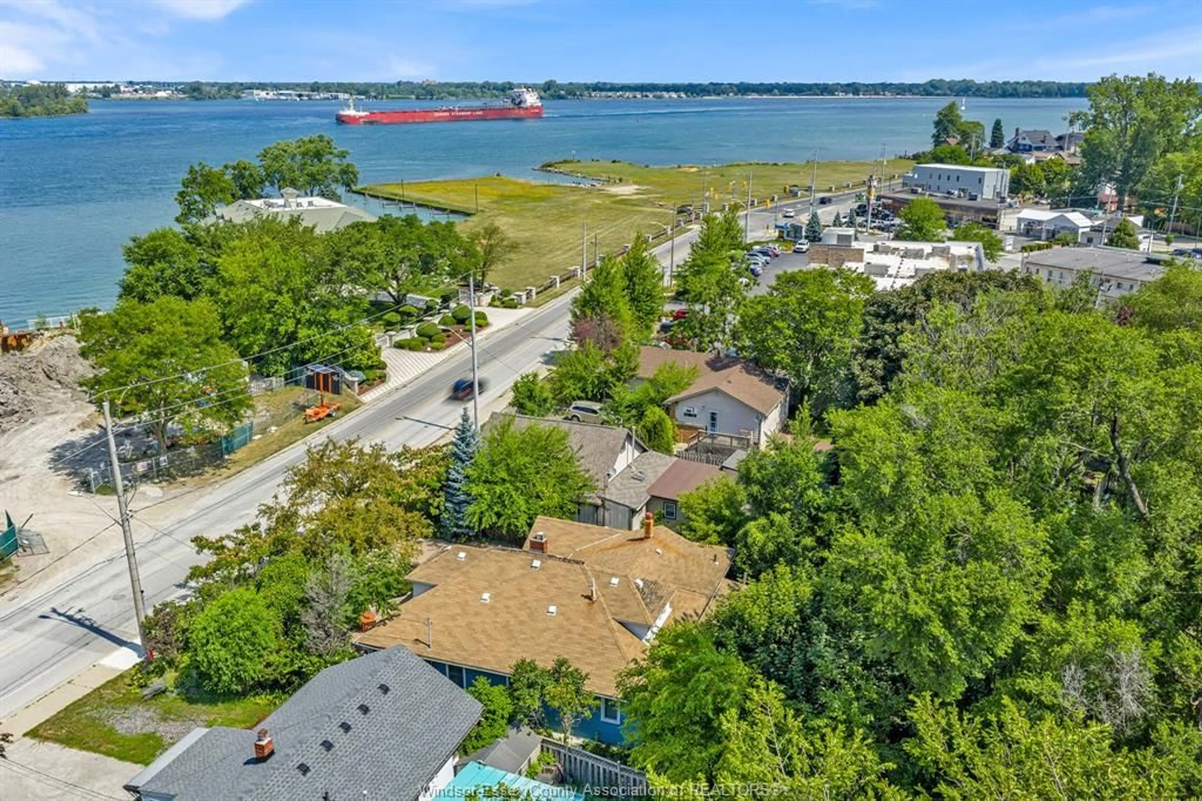 A pic from outside/outdoor area/front of a property/back of a property/a pic from drone, water/lake/river/ocean view for 7785 RIVERSIDE Dr, Windsor Ontario N8S 1E1