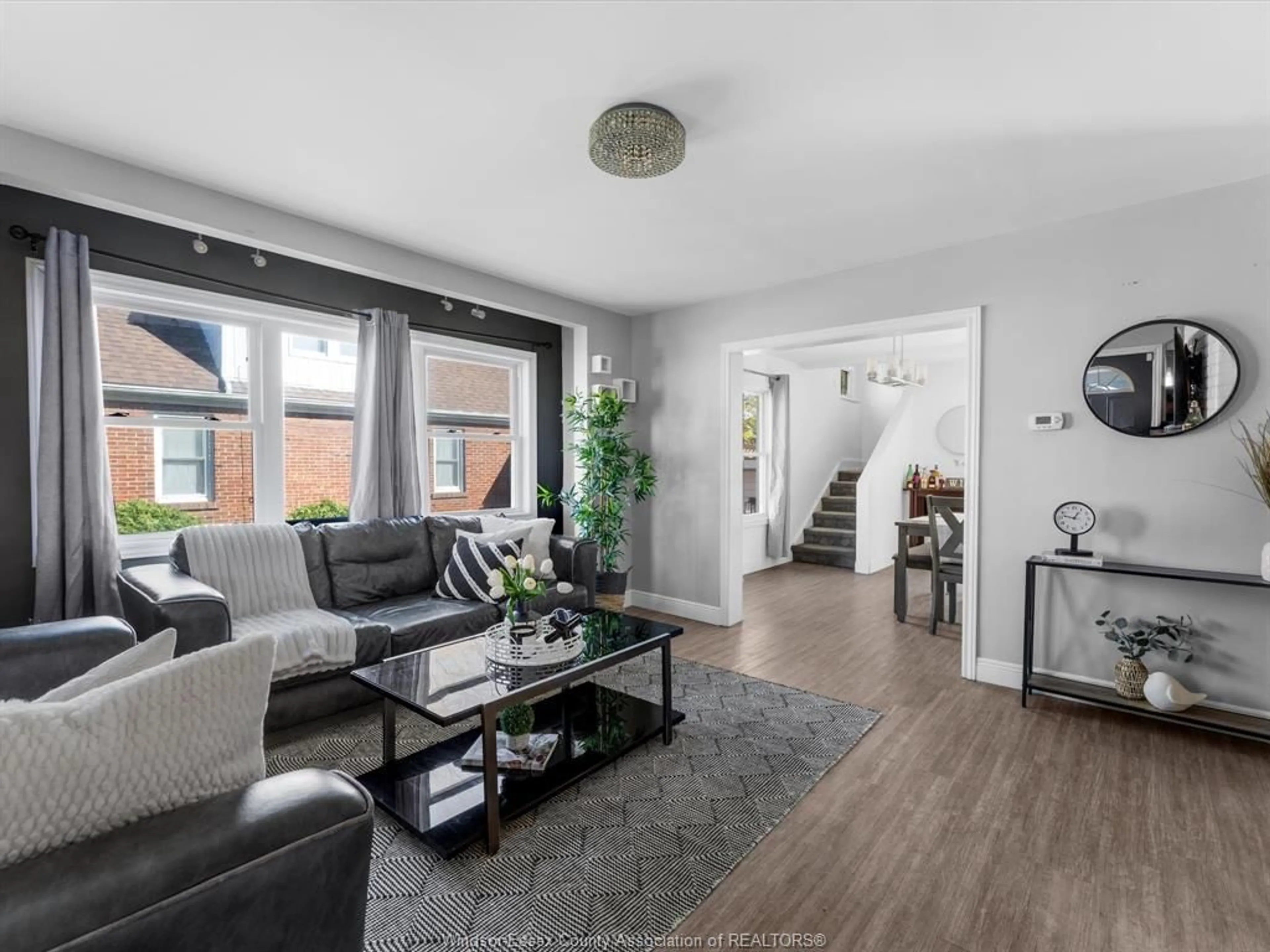 Living room with furniture, wood/laminate floor for 46 Wilson Ave, Chatham Ontario N7L 1K7