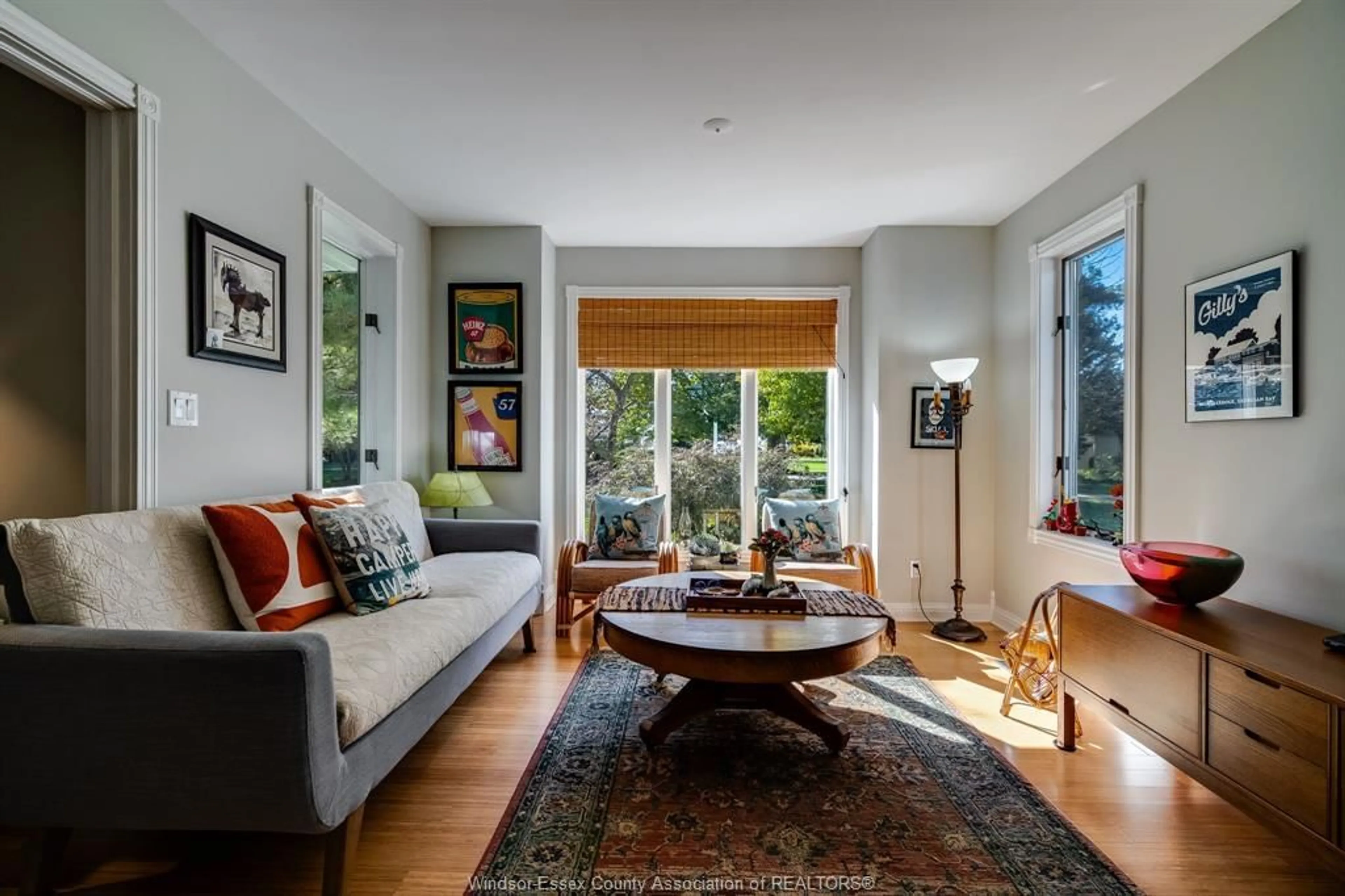 Living room with furniture, wood/laminate floor for 1126 Campbell Lane, Kingsville Ontario N9Y 2G4