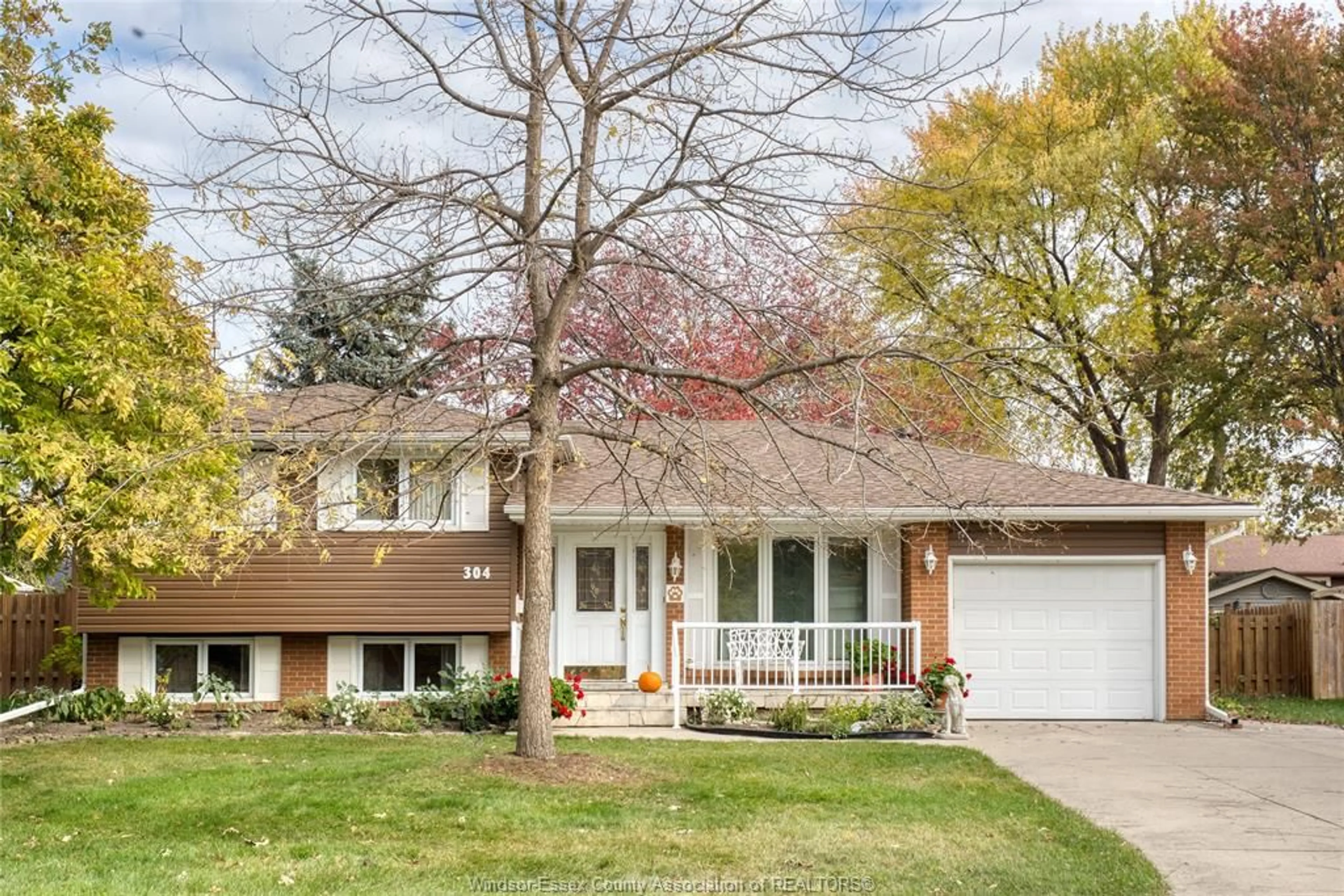 Home with brick exterior material, street for 304 Fairway Cres, Tecumseh Ontario N8N 2Z2