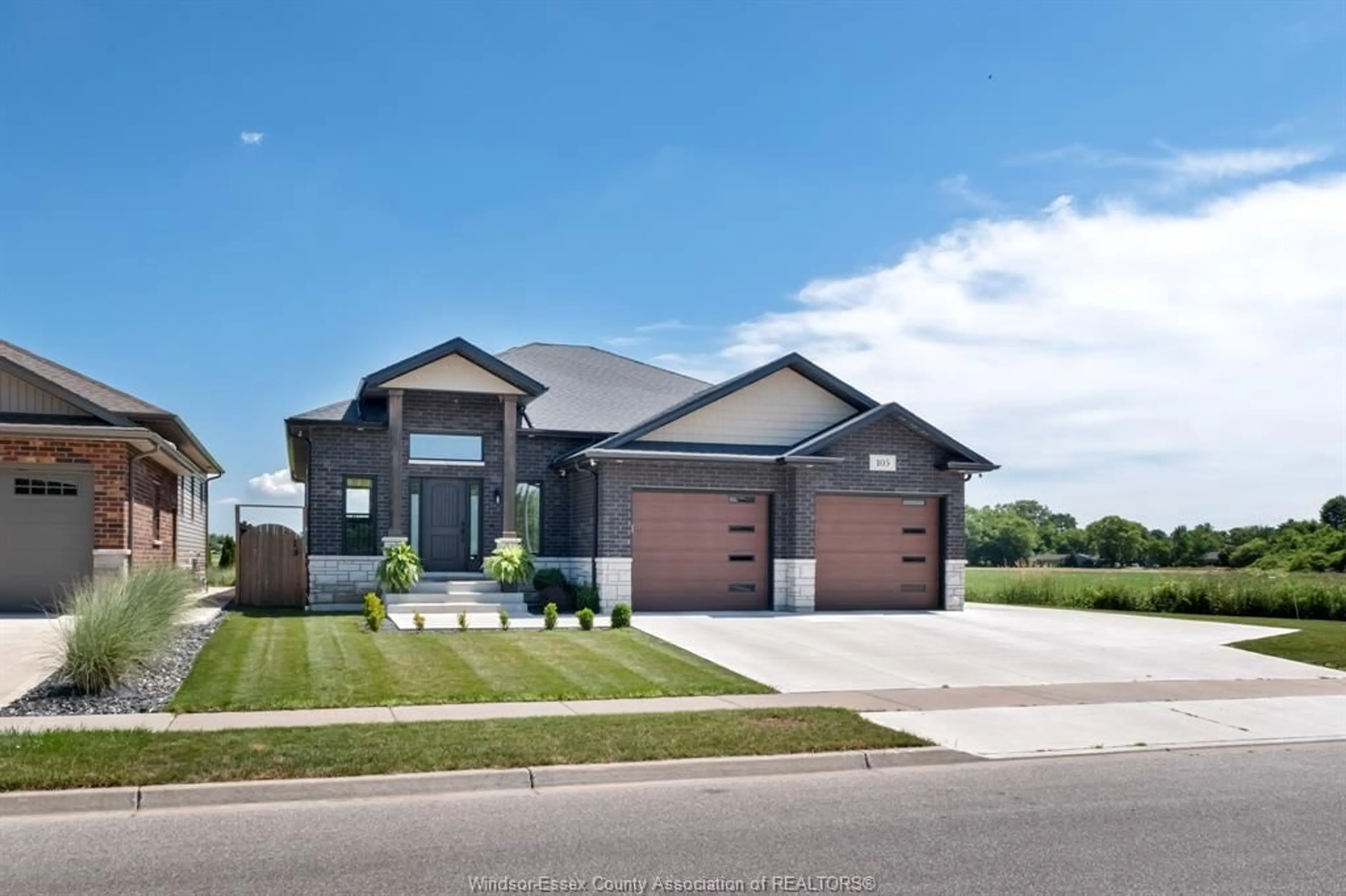 Home with brick exterior material, street for 105 CONSERVATION Blvd, Kingsville Ontario N9V 0E4