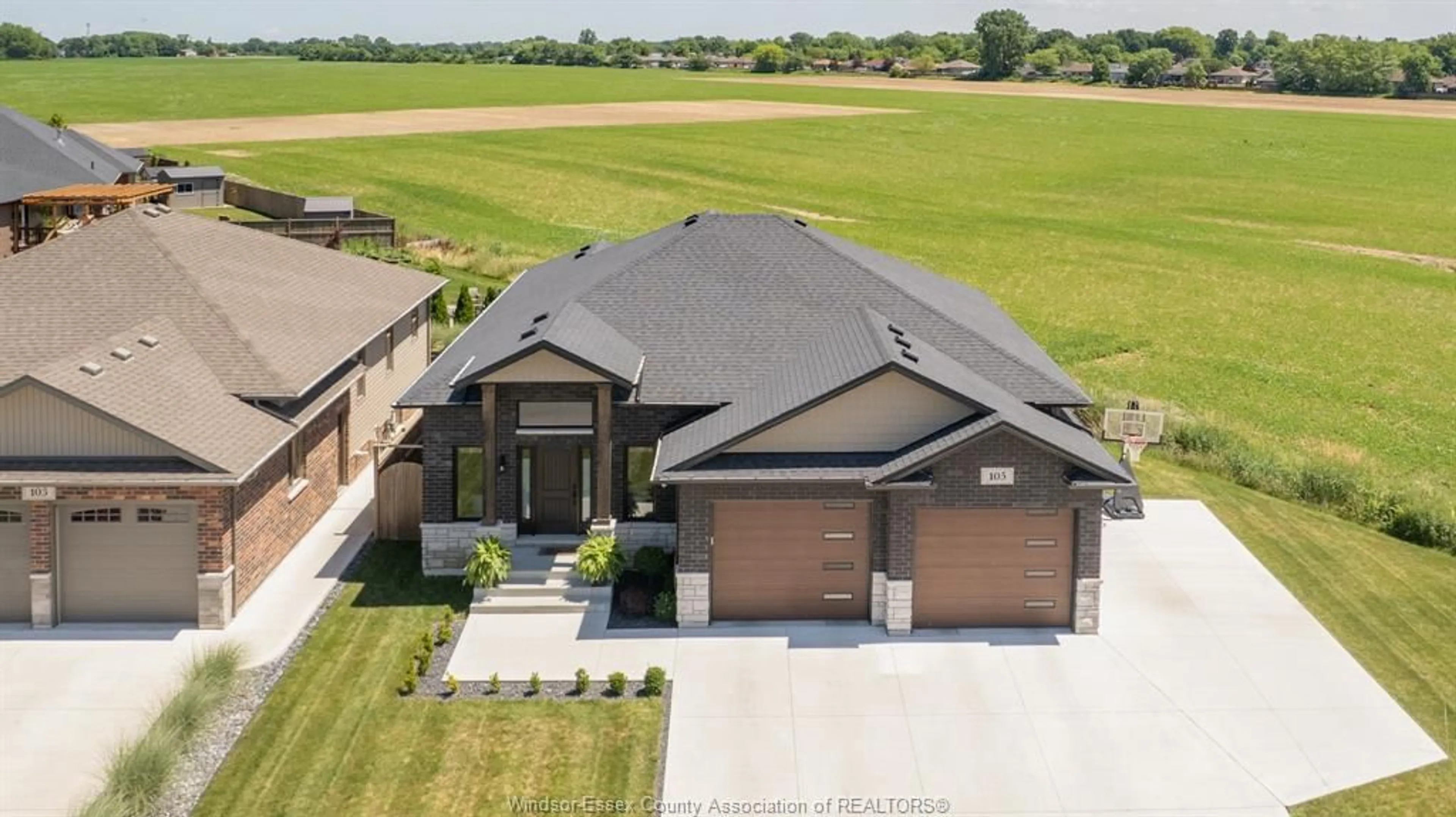 A pic from outside/outdoor area/front of a property/back of a property/a pic from drone, unknown for 105 CONSERVATION Blvd, Kingsville Ontario N9V 0E4