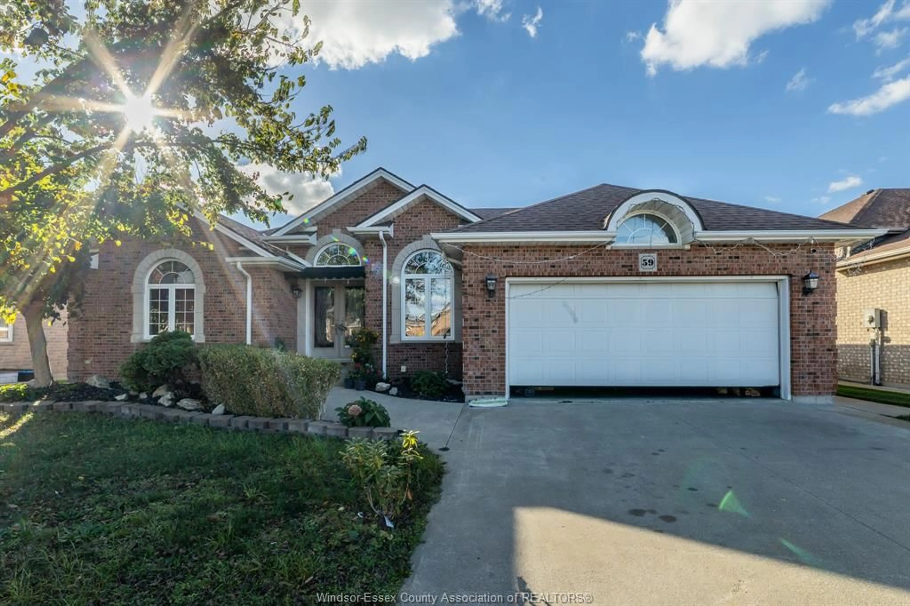 Home with brick exterior material, street for 59 SANDY LAKE Dr, Leamington Ontario N8M 5K4