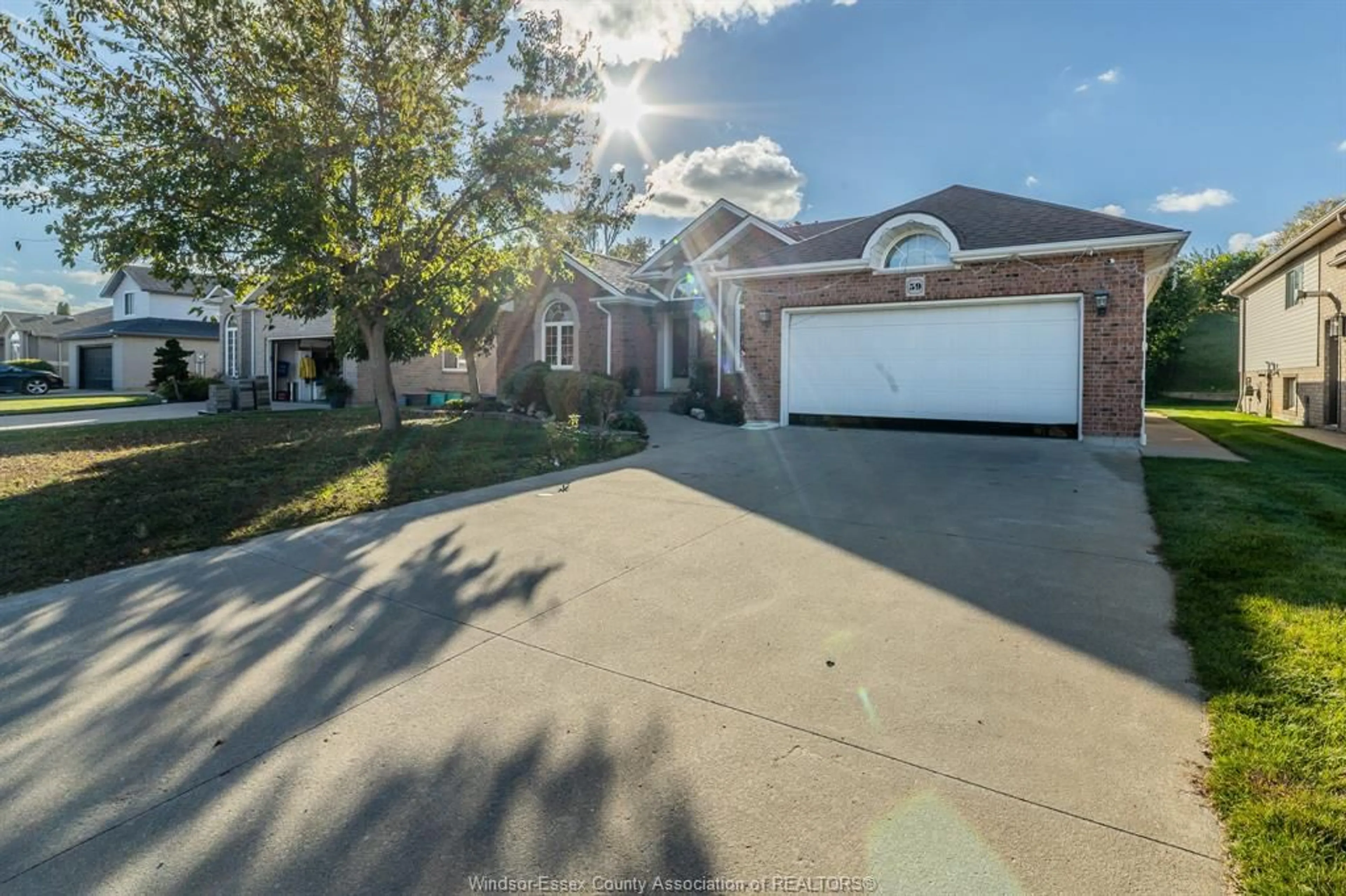 A pic from outside/outdoor area/front of a property/back of a property/a pic from drone, street for 59 SANDY LAKE Dr, Leamington Ontario N8M 5K4