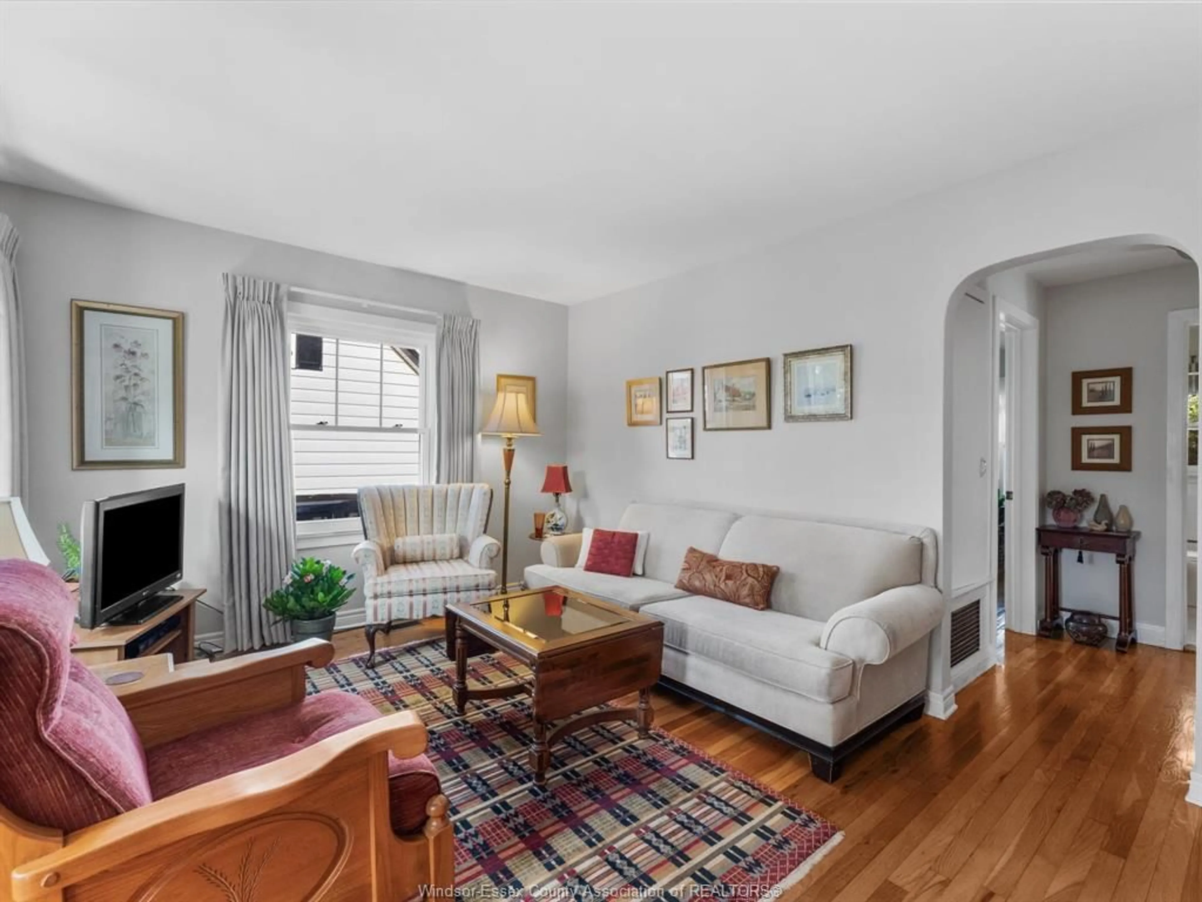 Living room with furniture, wood/laminate floor for 846 REEDMERE, Windsor Ontario N8S 2L5