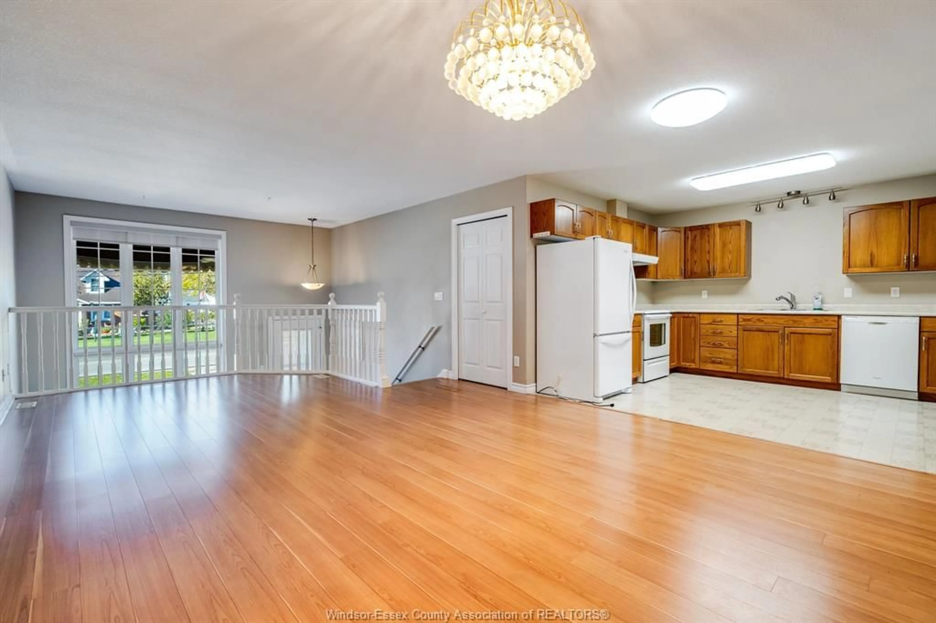 Open concept kitchen, wood/laminate floor for 54A Queen St. S, Tilbury Ontario N0P 2L0