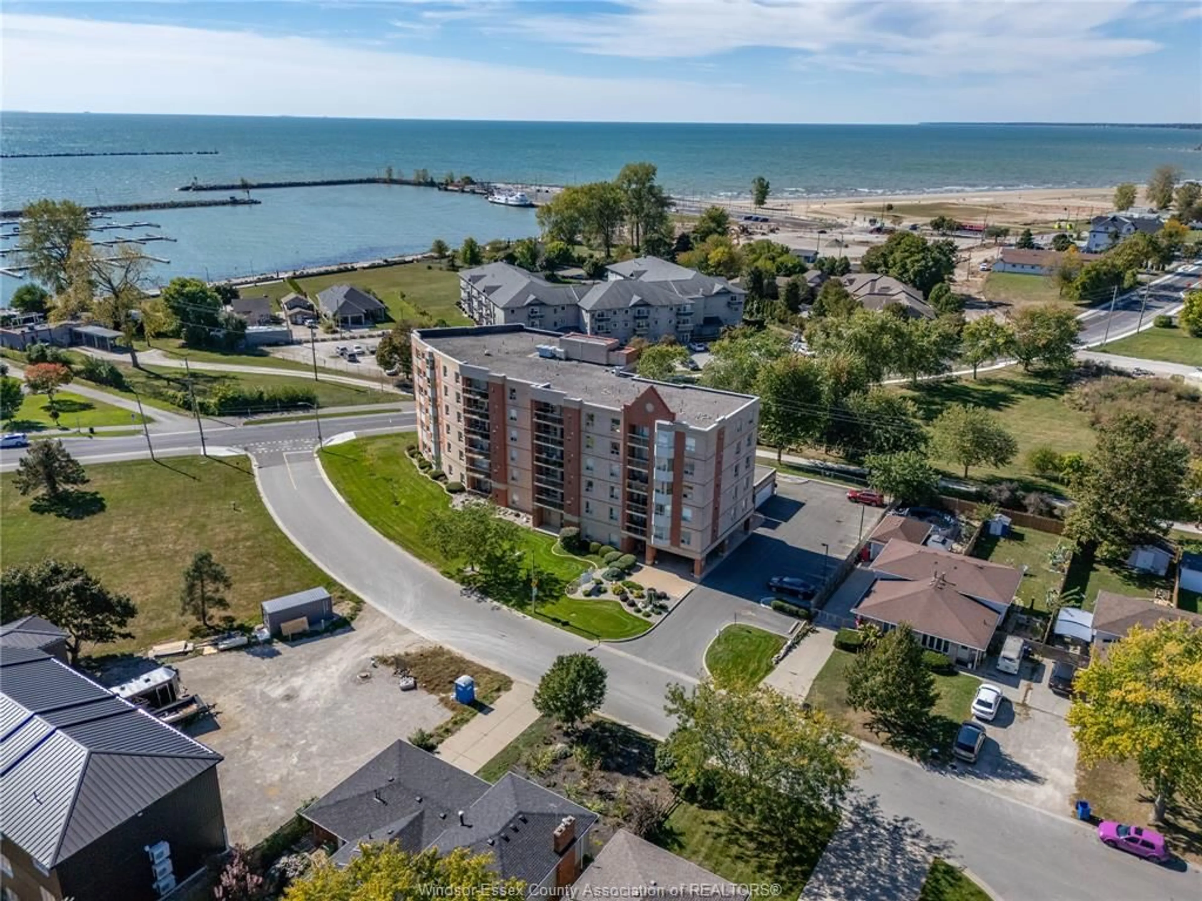A pic from outside/outdoor area/front of a property/back of a property/a pic from drone, water/lake/river/ocean view for 99 ROBSON #203, Leamington Ontario N8H 2M8