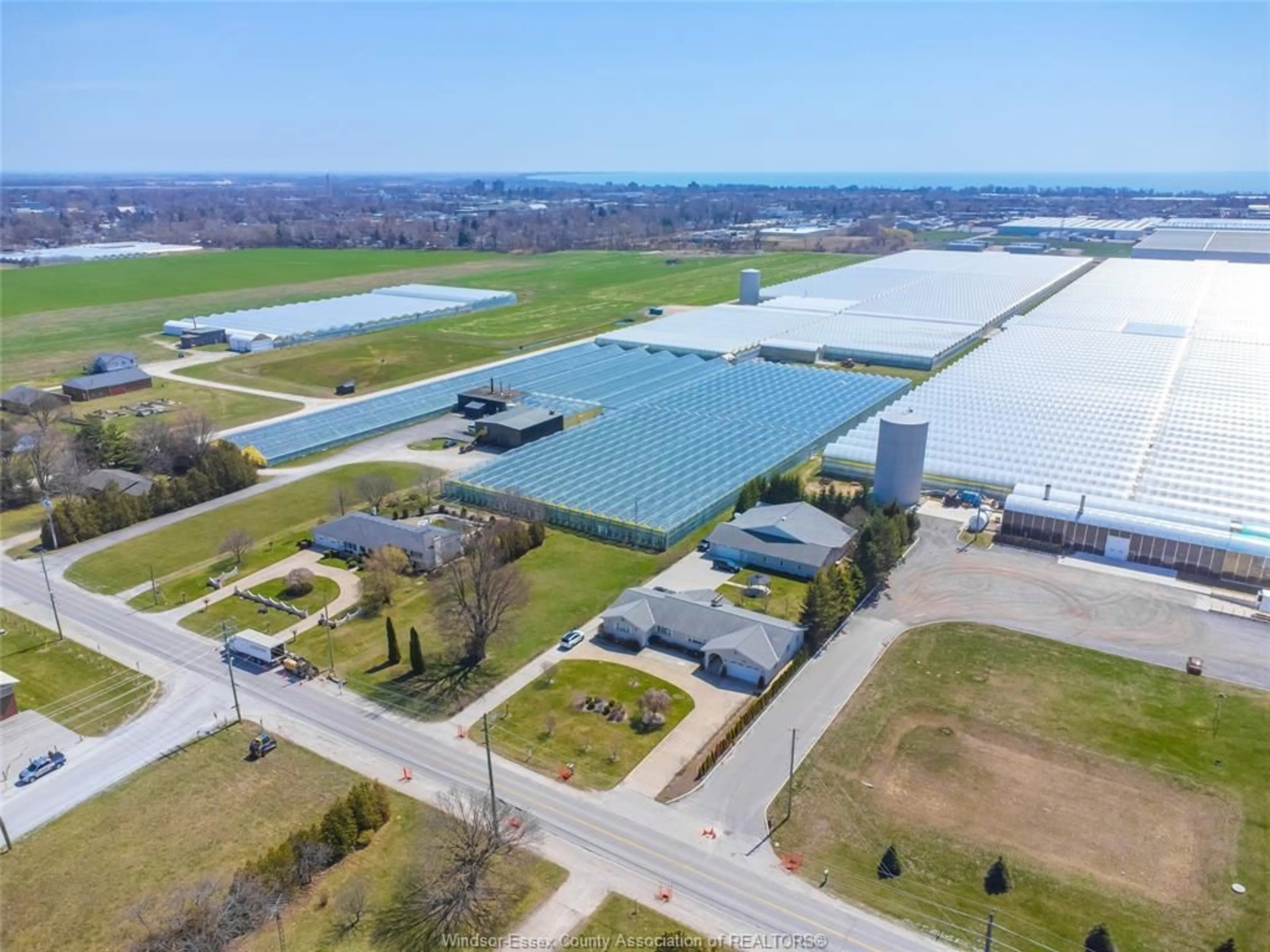 A pic from outside/outdoor area/front of a property/back of a property/a pic from drone, building for 408 MERSEA RD 3, Leamington Ontario N8H 3V5