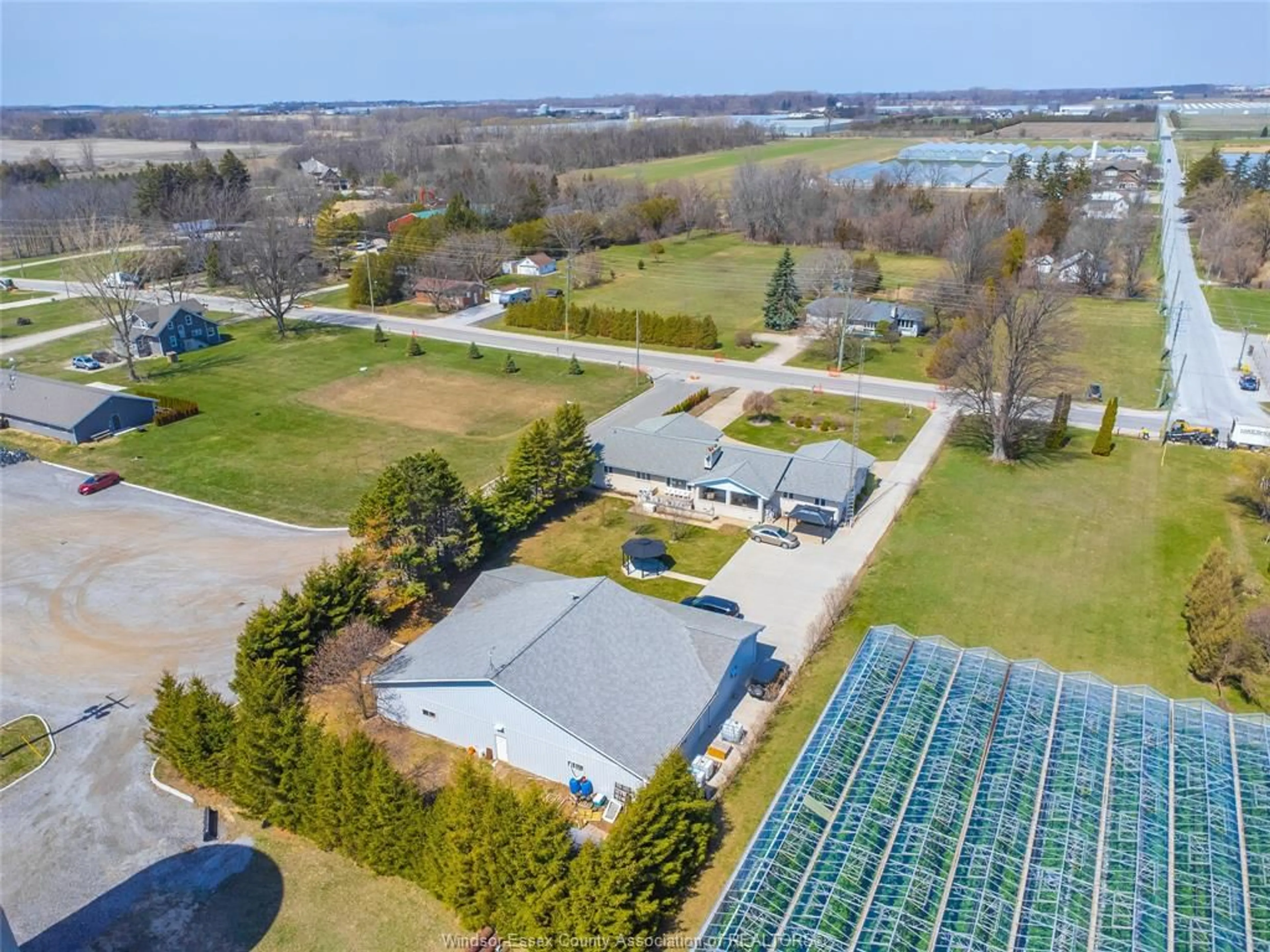 A pic from outside/outdoor area/front of a property/back of a property/a pic from drone, water/lake/river/ocean view for 408 MERSEA RD 3, Leamington Ontario N8H 3V5