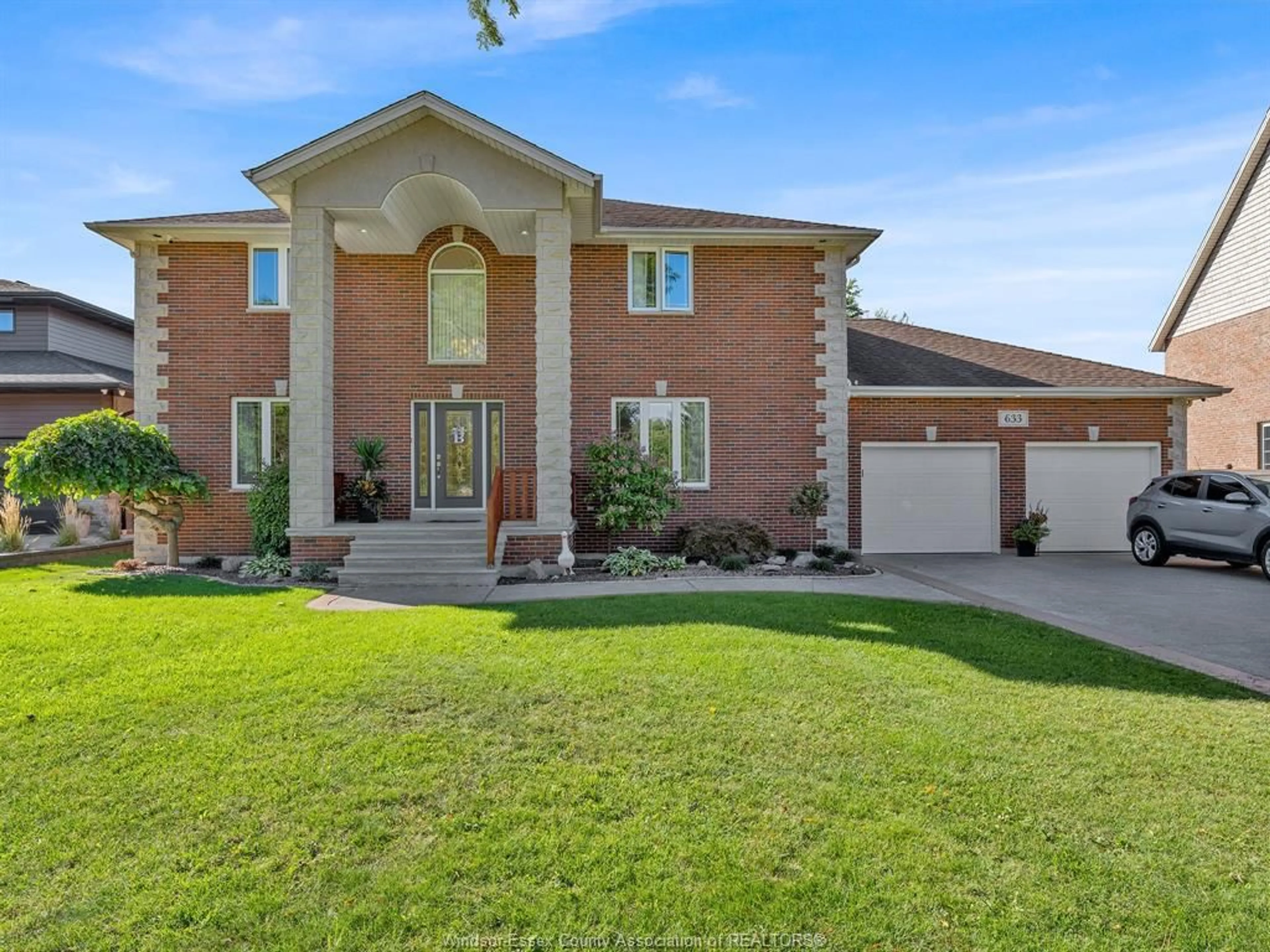 Home with brick exterior material, street for 633 OLD TECUMSEH Rd, Lakeshore Ontario N0R 1A0