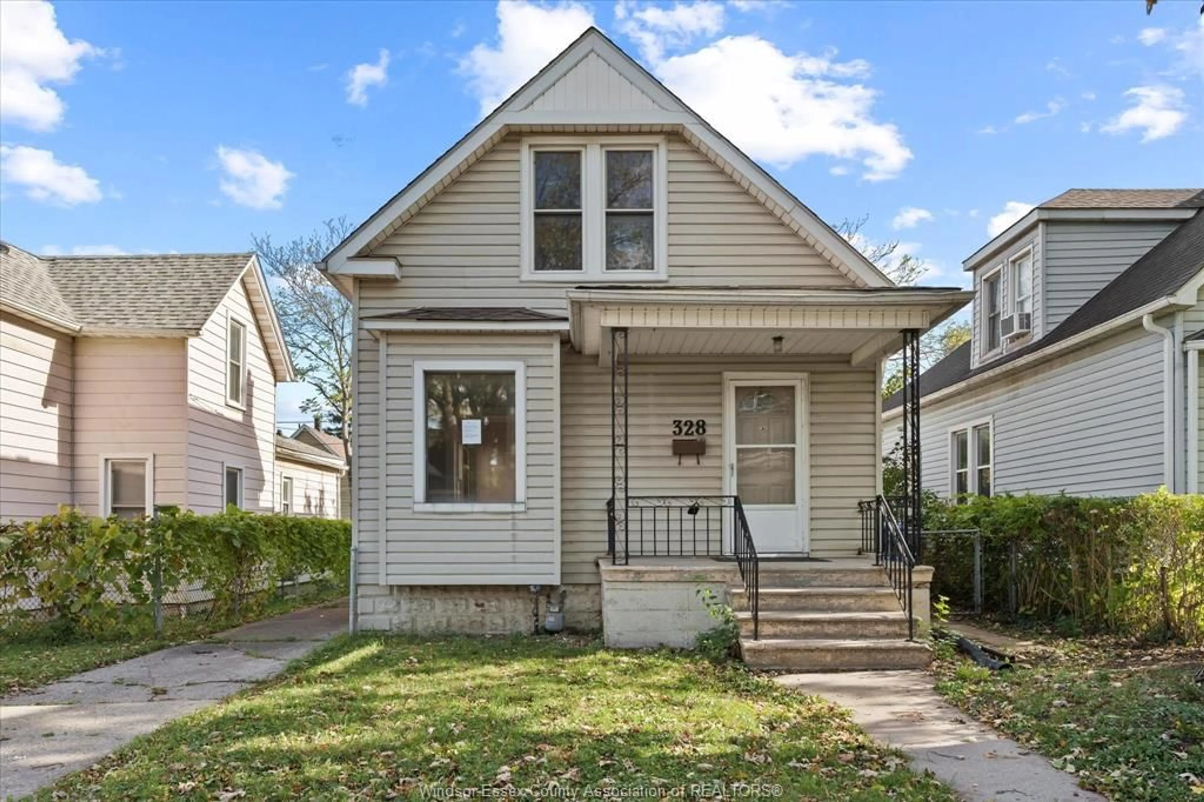 Home with vinyl exterior material, street for 328 BRIDGE Ave, Windsor Ontario N9B 2M4