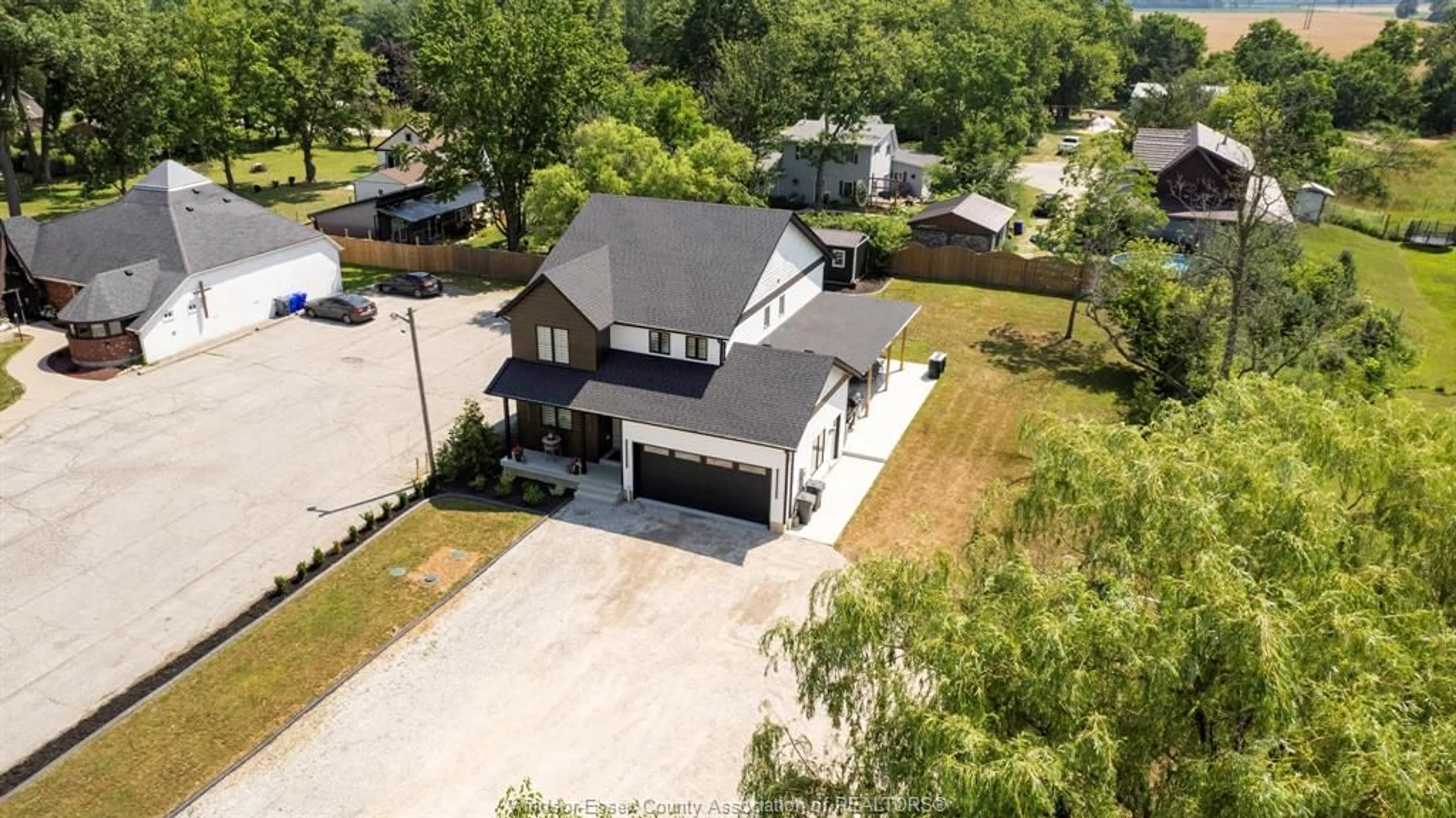 A pic from outside/outdoor area/front of a property/back of a property/a pic from drone, street for 2618 COUNTY RD 27, Woodslee Ontario N0R 1V0