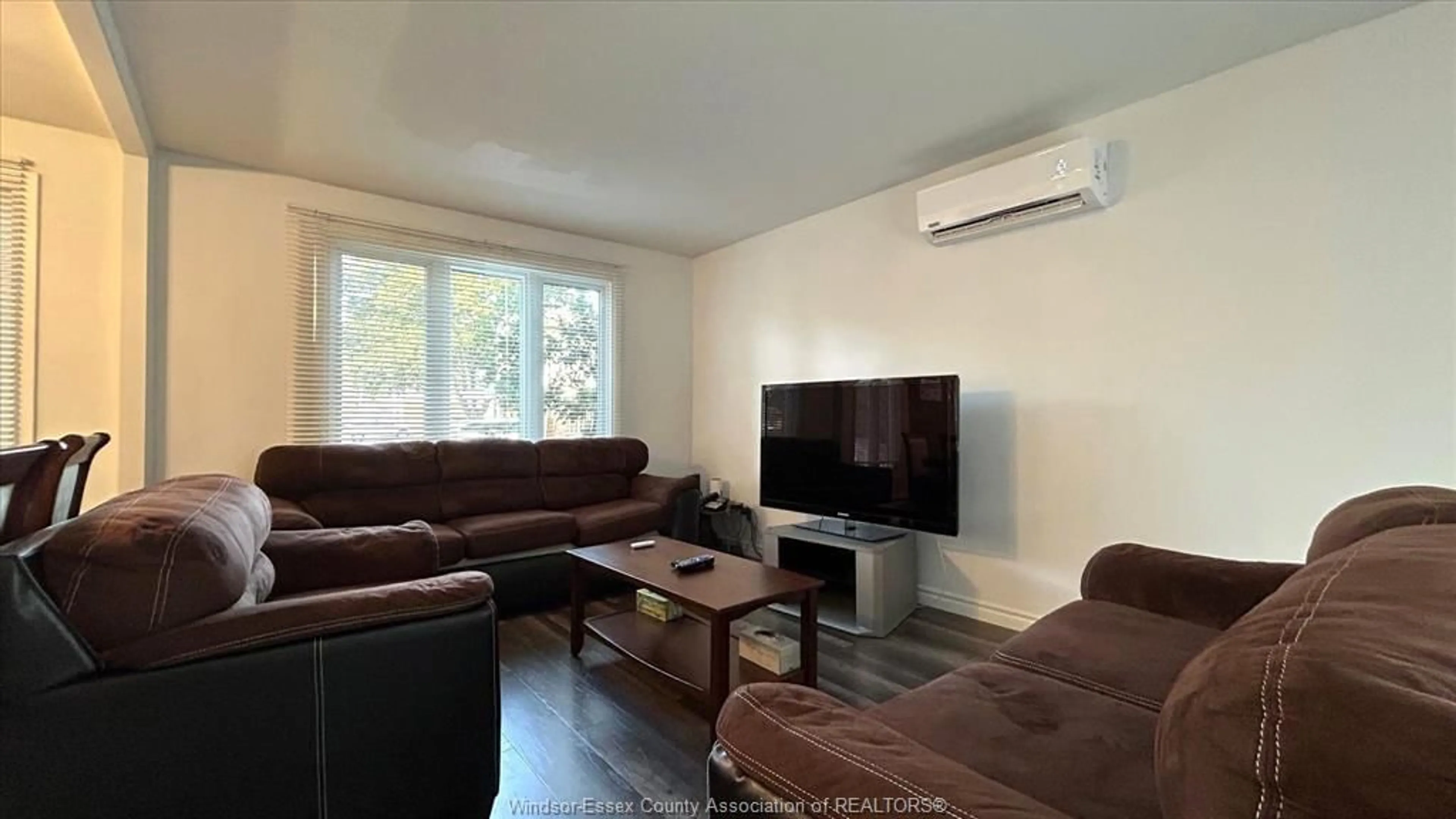 Living room with furniture, wood/laminate floor for 9054 CONWAY Crt, Windsor Ontario N8S 4G3