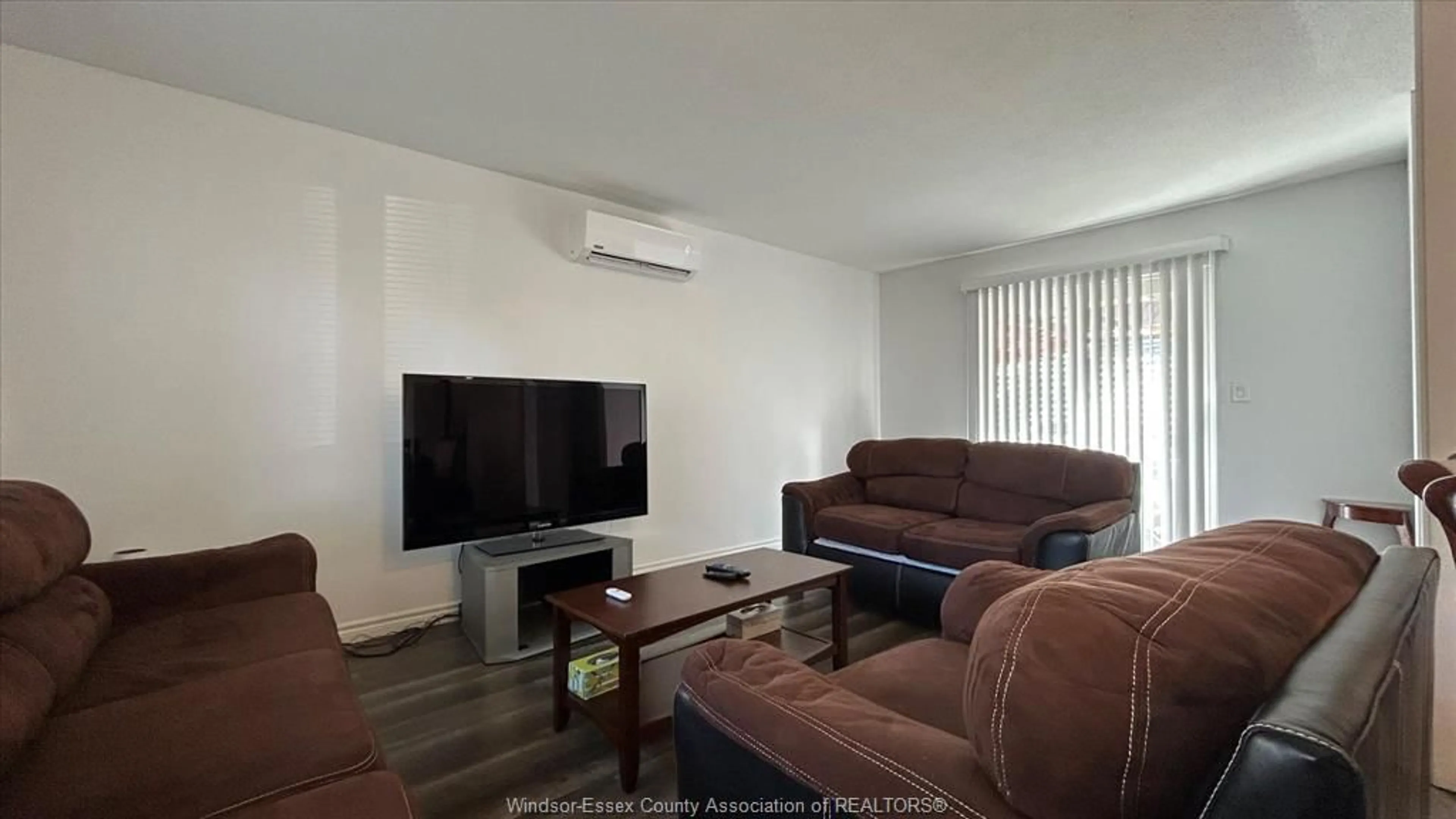 Living room with furniture, wood/laminate floor for 9054 CONWAY Crt, Windsor Ontario N8S 4G3