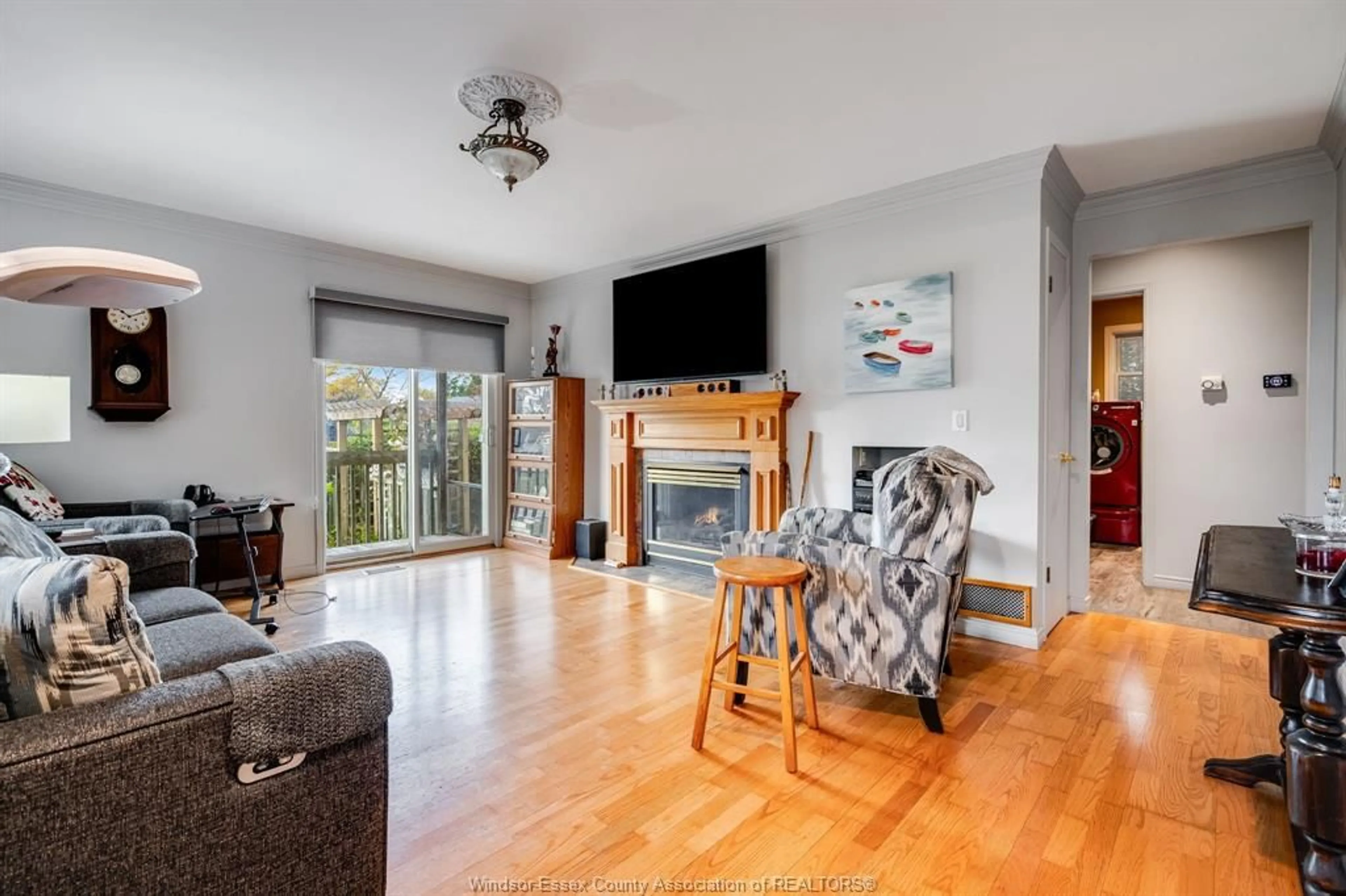 Living room with furniture, wood/laminate floor for 6121 EMERSON Ave, Lakeshore Ontario N0P 1J0