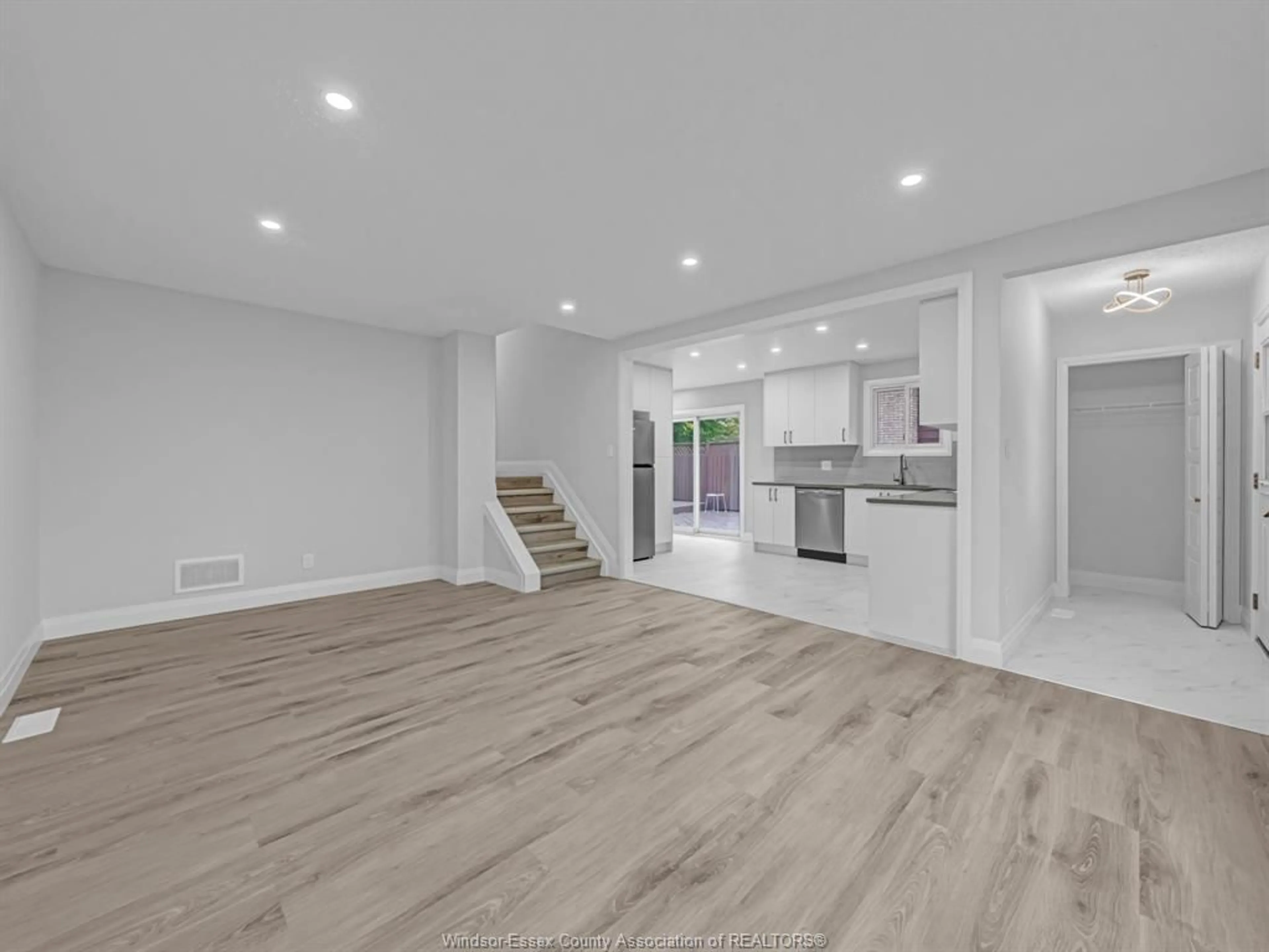 Open concept kitchen, wood/laminate floor for 3332 PINEVIEW Cres, Windsor Ontario N8R 2A7