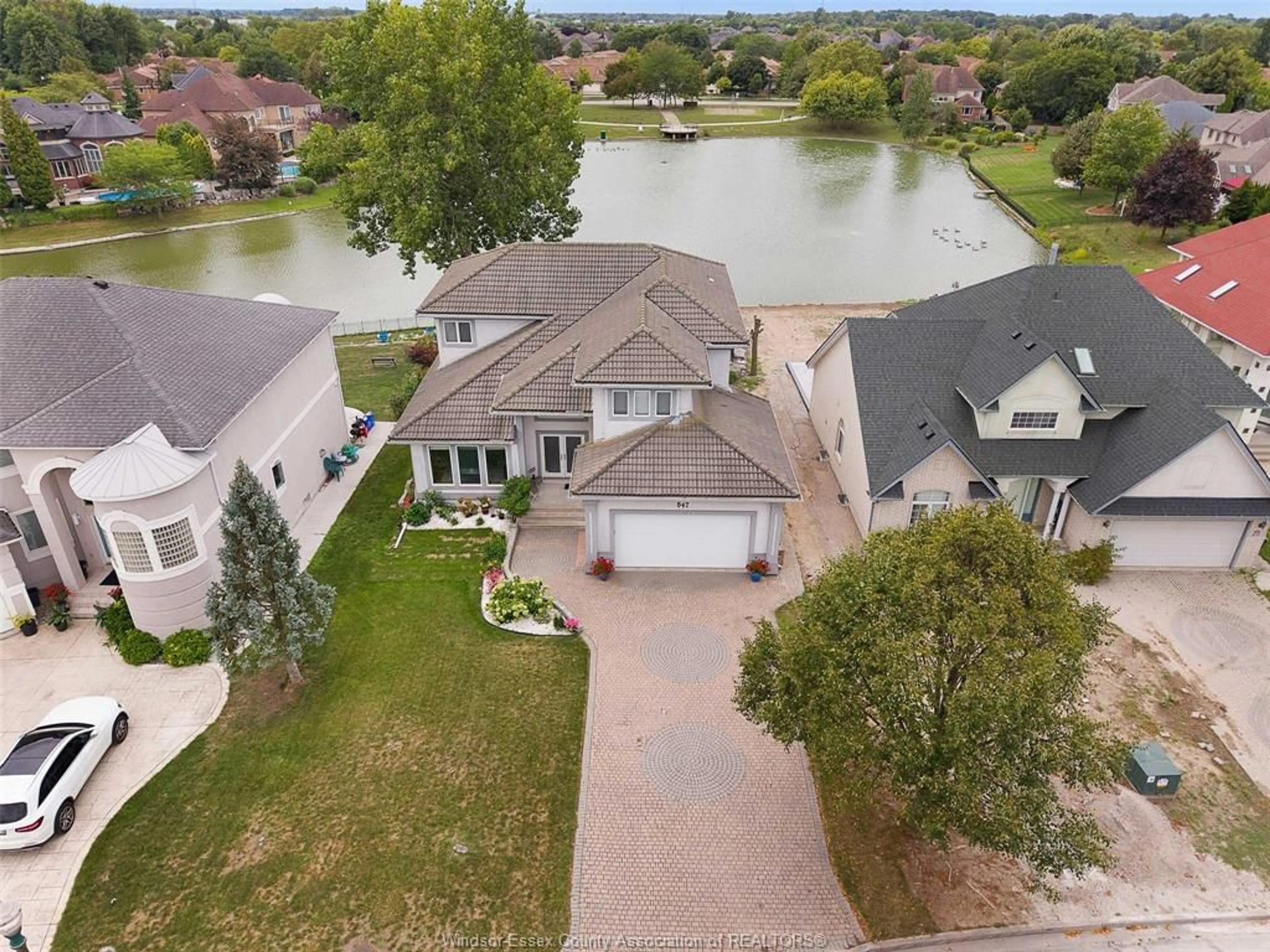 A pic from outside/outdoor area/front of a property/back of a property/a pic from drone, water/lake/river/ocean view for 847 LAKE SHORE Dr, Windsor Ontario N9G 2R1