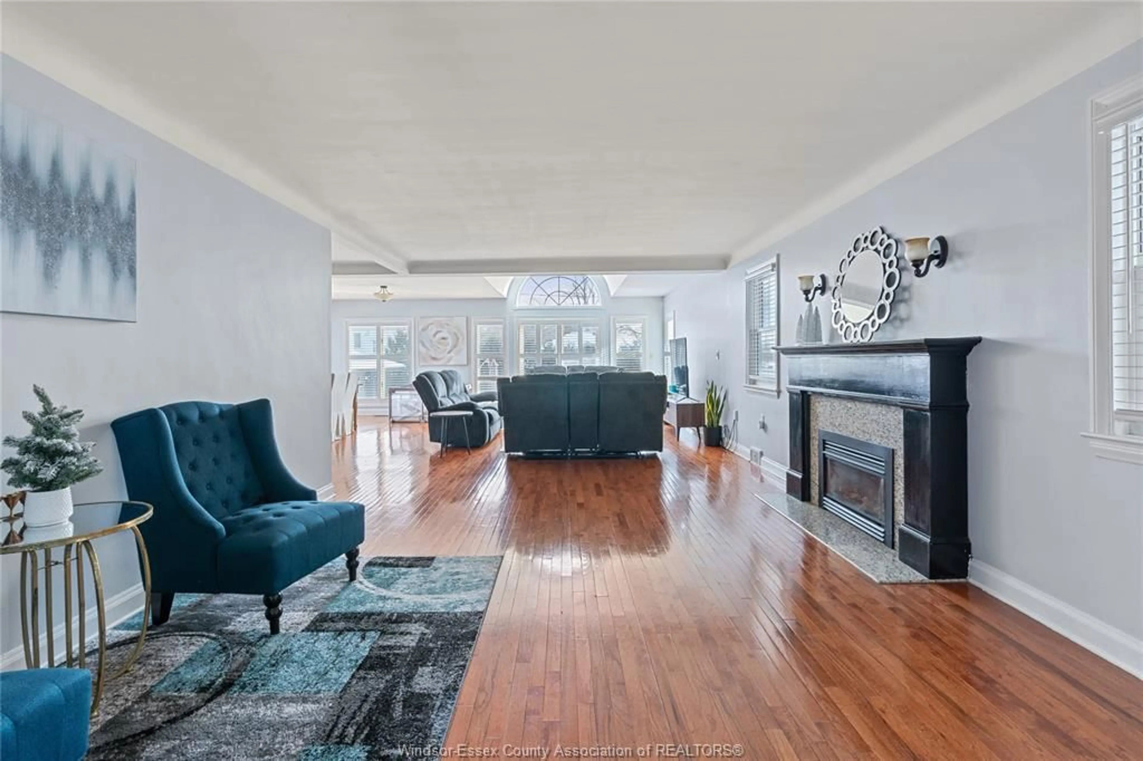 Living room with furniture, wood/laminate floor for 282 ROSSINI, Windsor Ontario N8N 2Z1