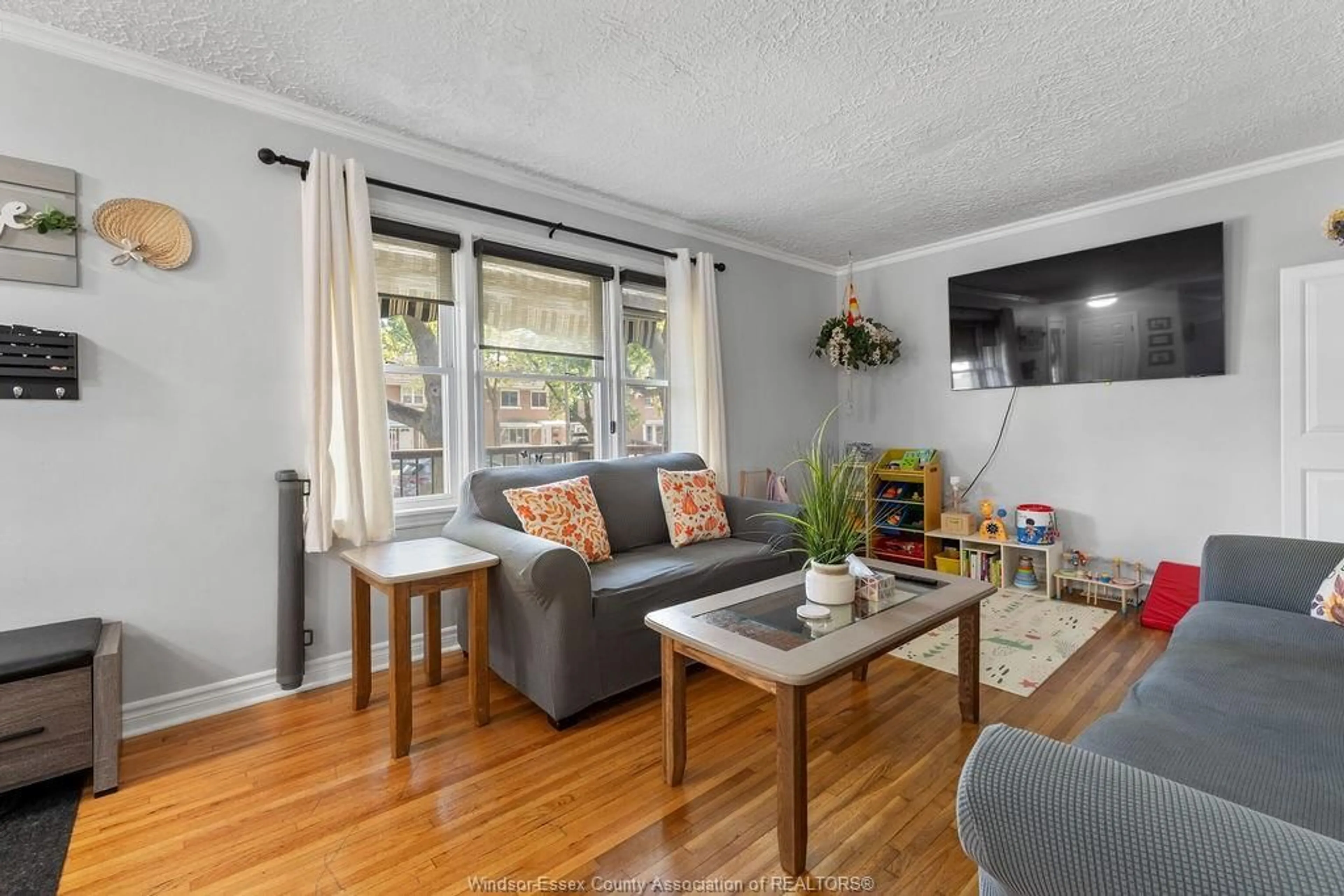 Living room with furniture, wood/laminate floor for 2136 Secord Ave, Windsor Ontario N9B 1T1