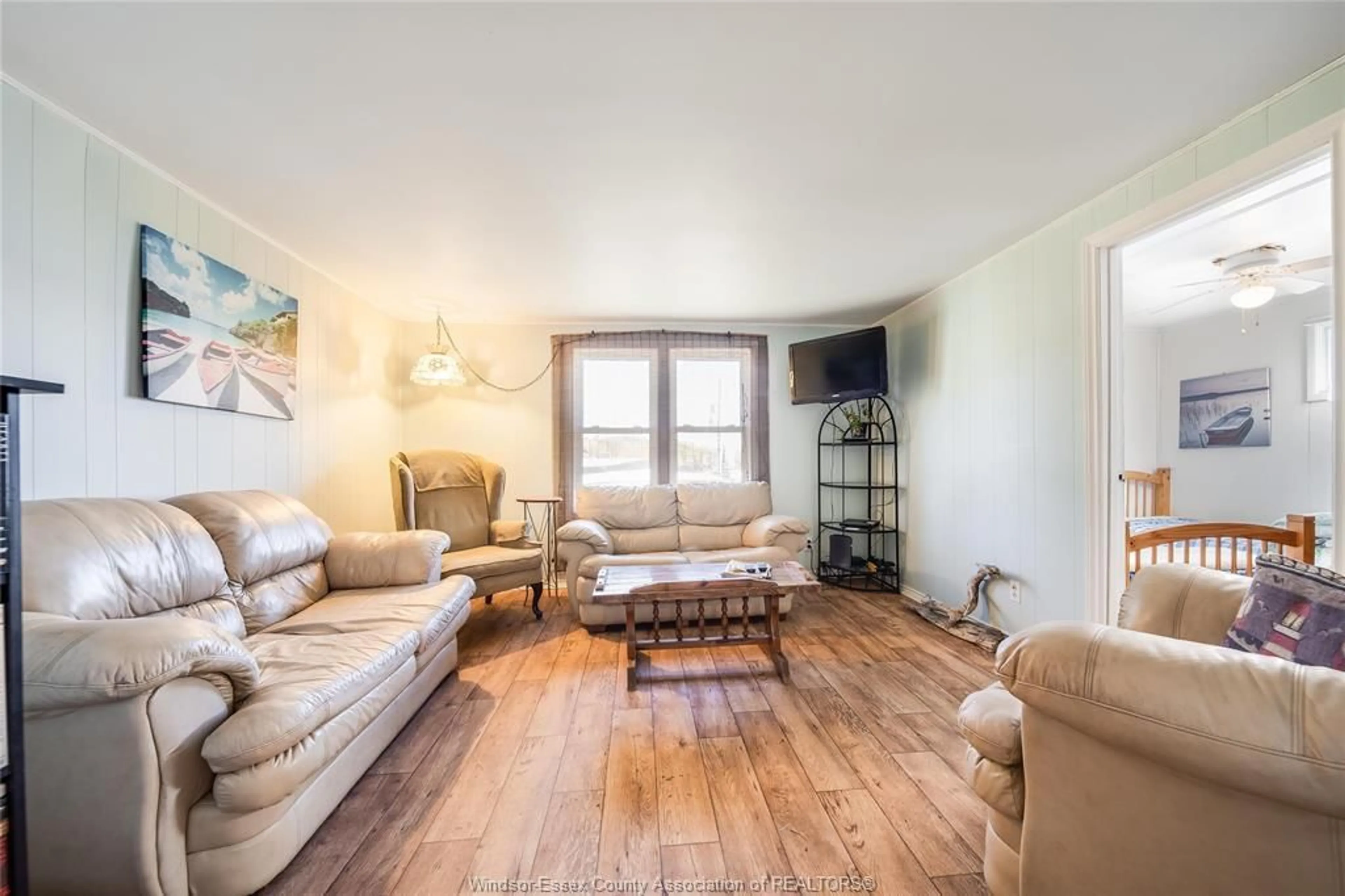 Living room with furniture, wood/laminate floor for 1520 KERR Ave, Erieau Ontario N0P 1N0