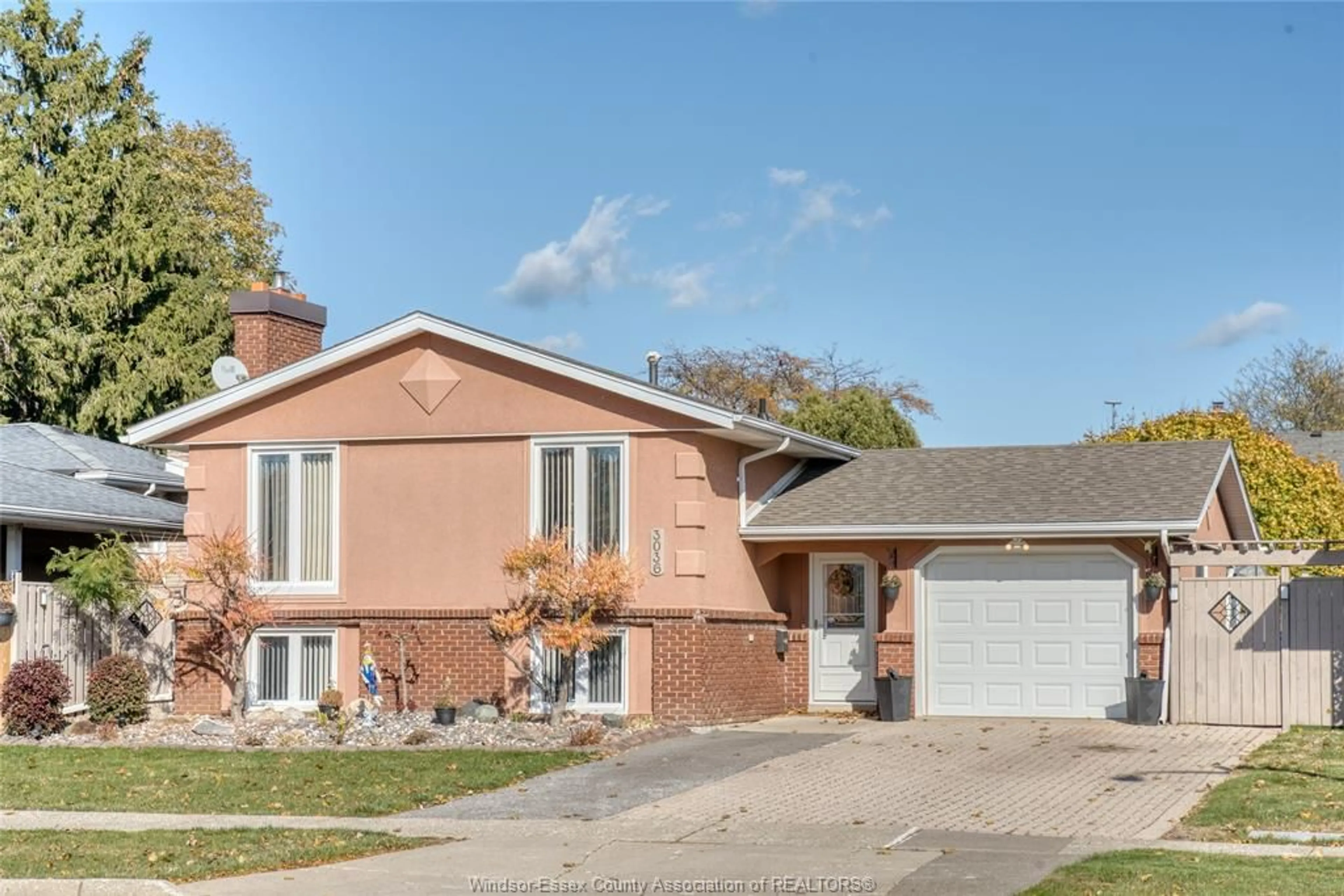 Home with brick exterior material, street for 3036 FOREST GLADE Dr, Windsor Ontario N8R 1L5