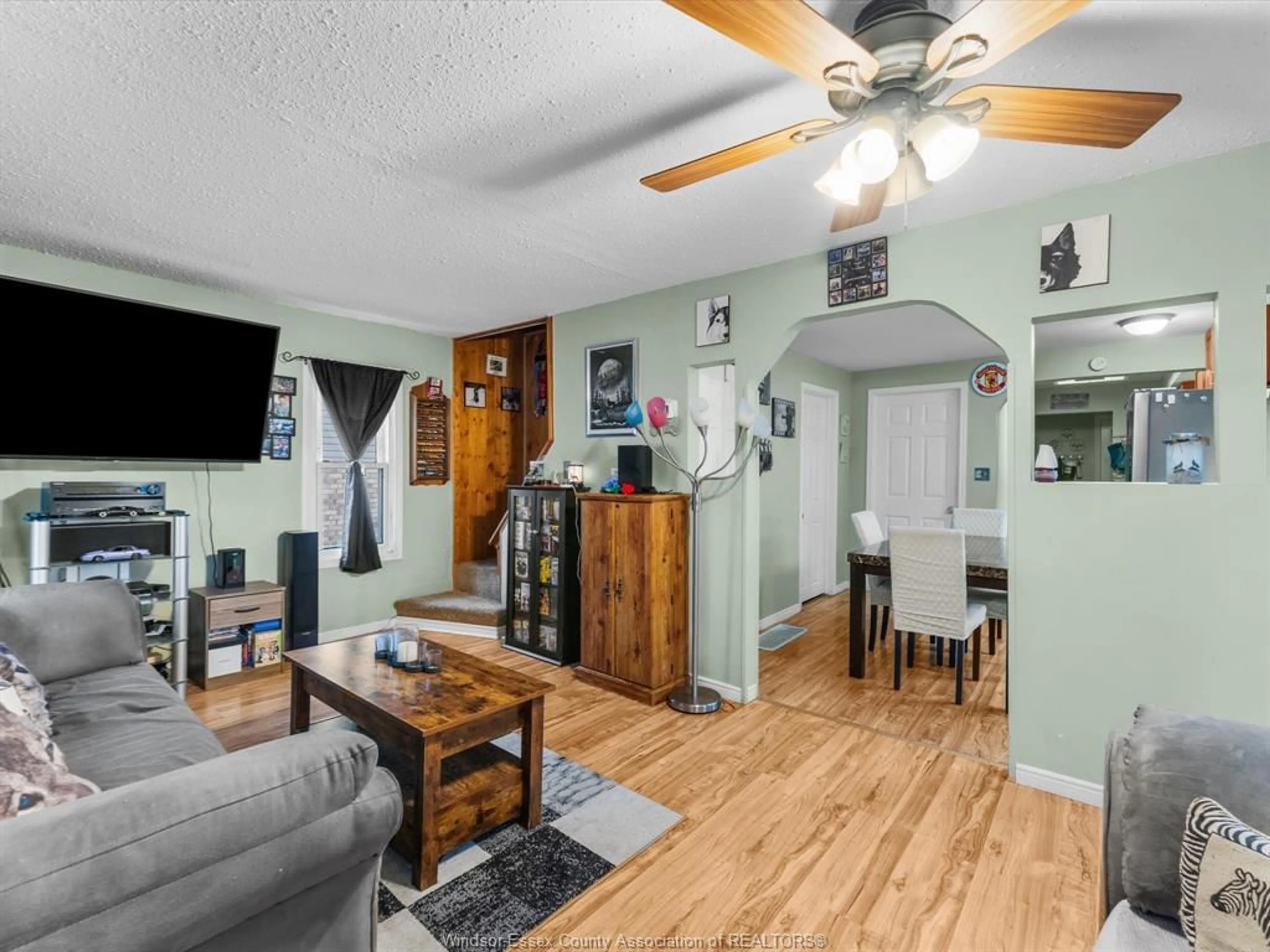 Living room with furniture, wood/laminate floor for 2509 ALEXIS Rd, Windsor Ontario N9J 1Y3