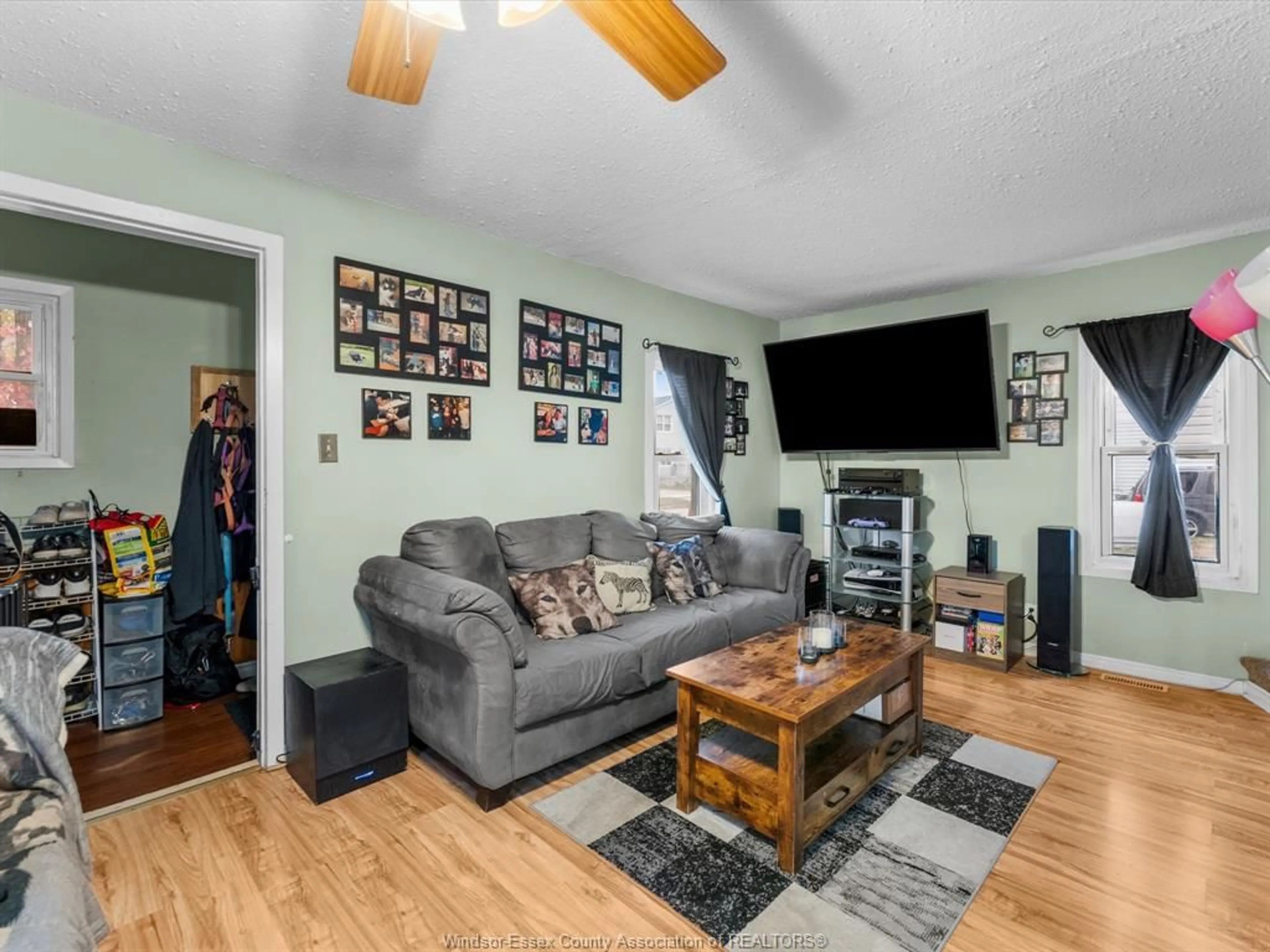 Living room with furniture, wood/laminate floor for 2509 ALEXIS Rd, Windsor Ontario N9J 1Y3