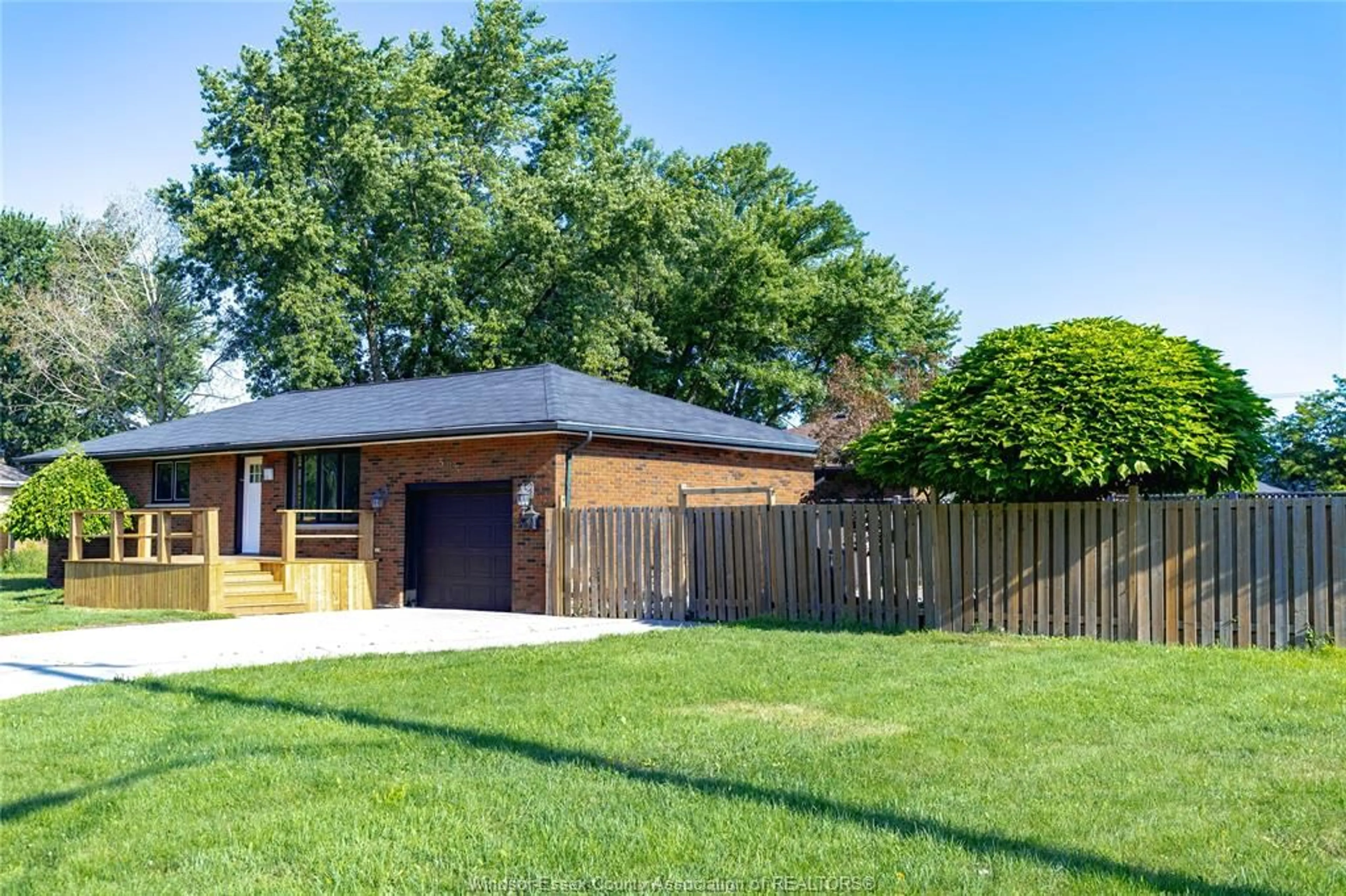 Home with brick exterior material, street for 595 COUNTY RD 2, Lakeshore Ontario N0R 1A0