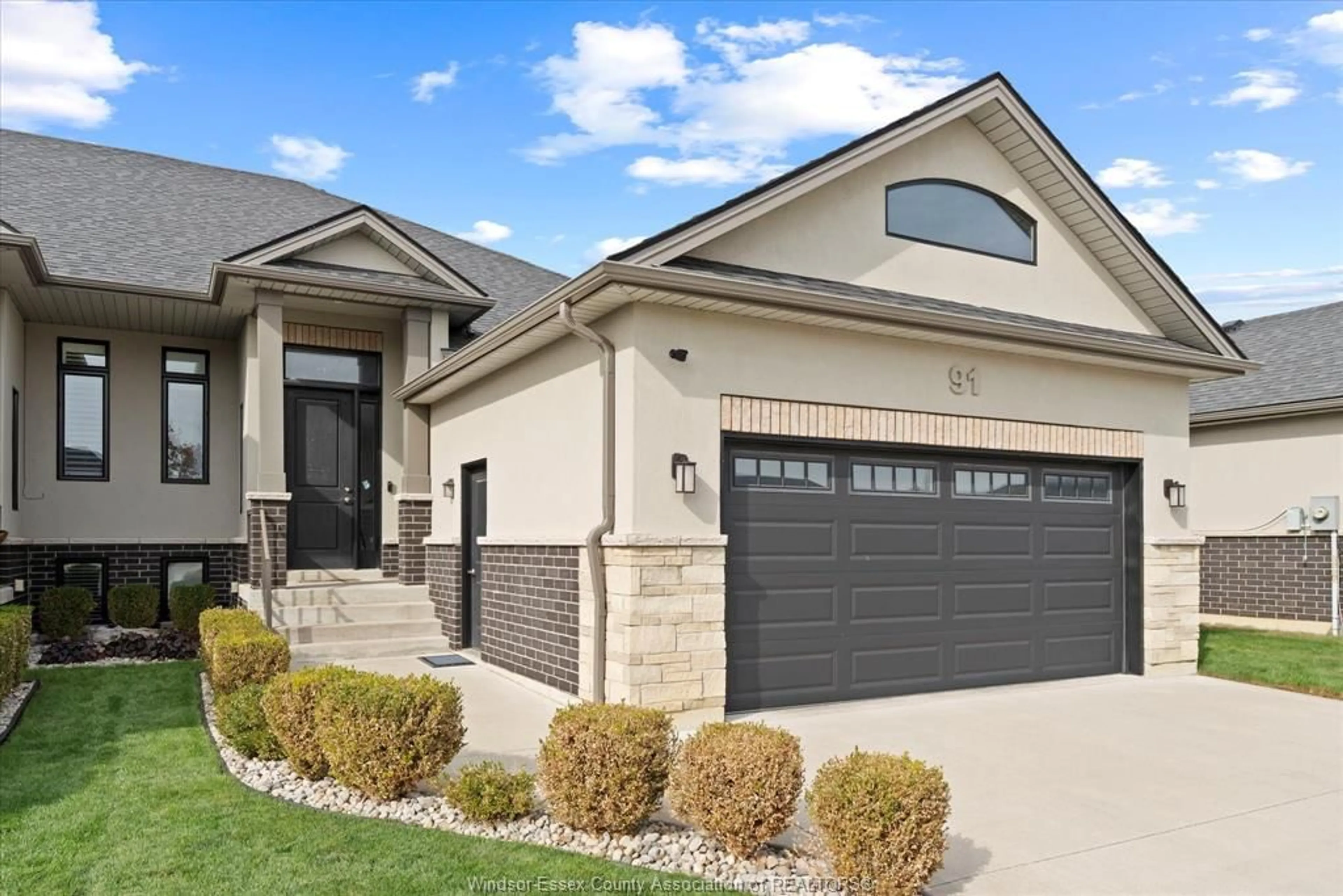 Home with brick exterior material, street for 91 CAROLINA WOODS Cres, Leamington Ontario N8H 5N2