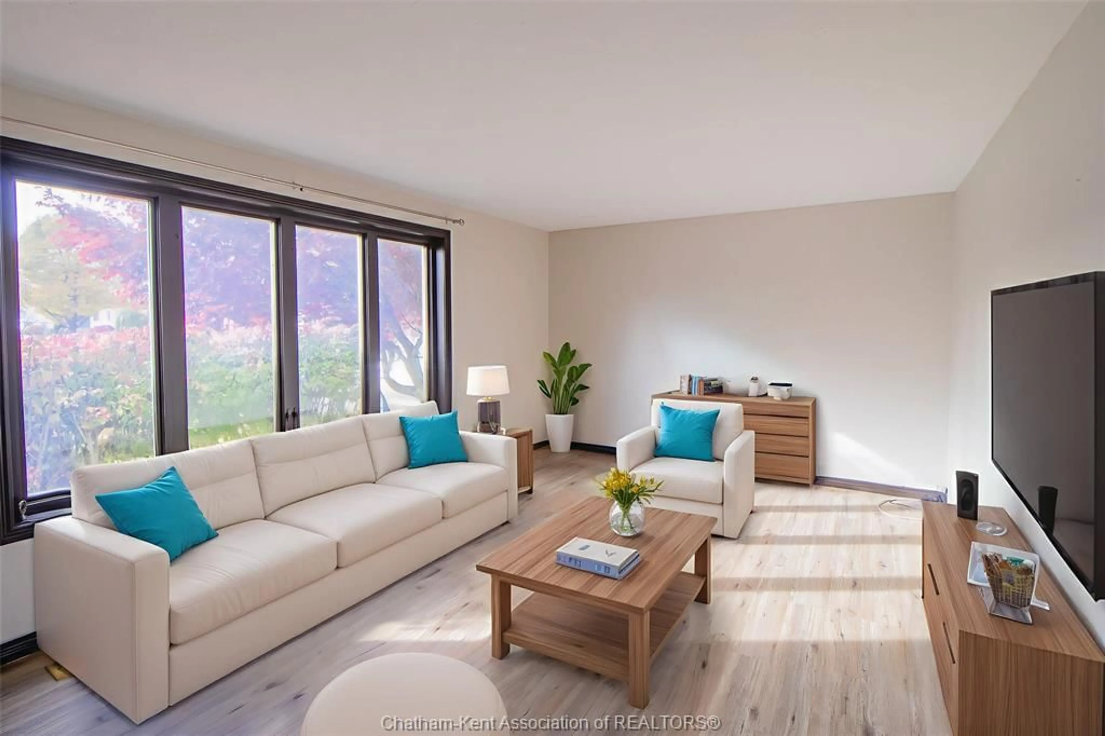 Living room with furniture, wood/laminate floor for 80 Goldpark Rd, Chatham Ontario N7L 4Y1