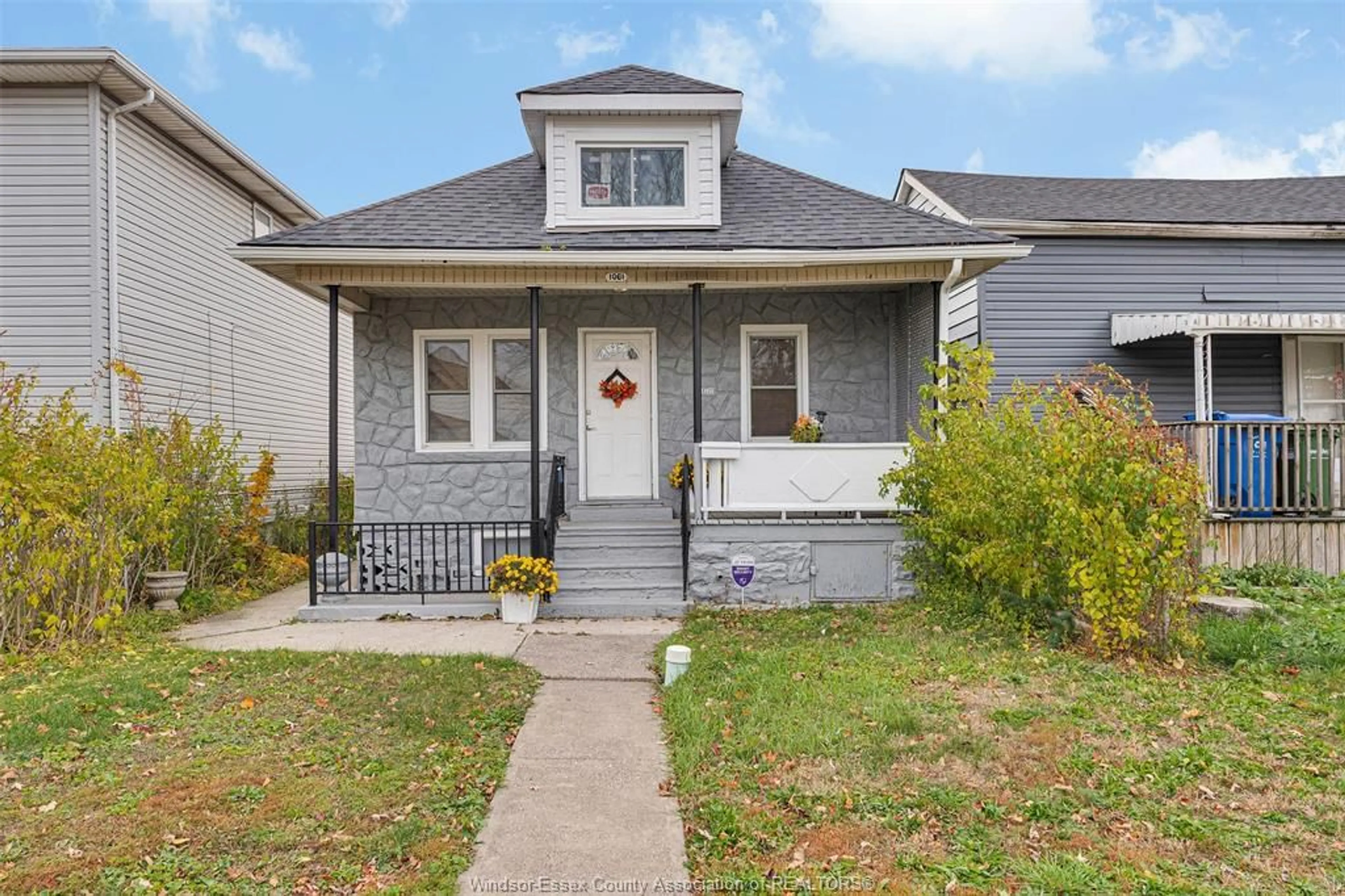 Home with vinyl exterior material, street for 1061 HIGHLAND Ave, Windsor Ontario N9A 1R6