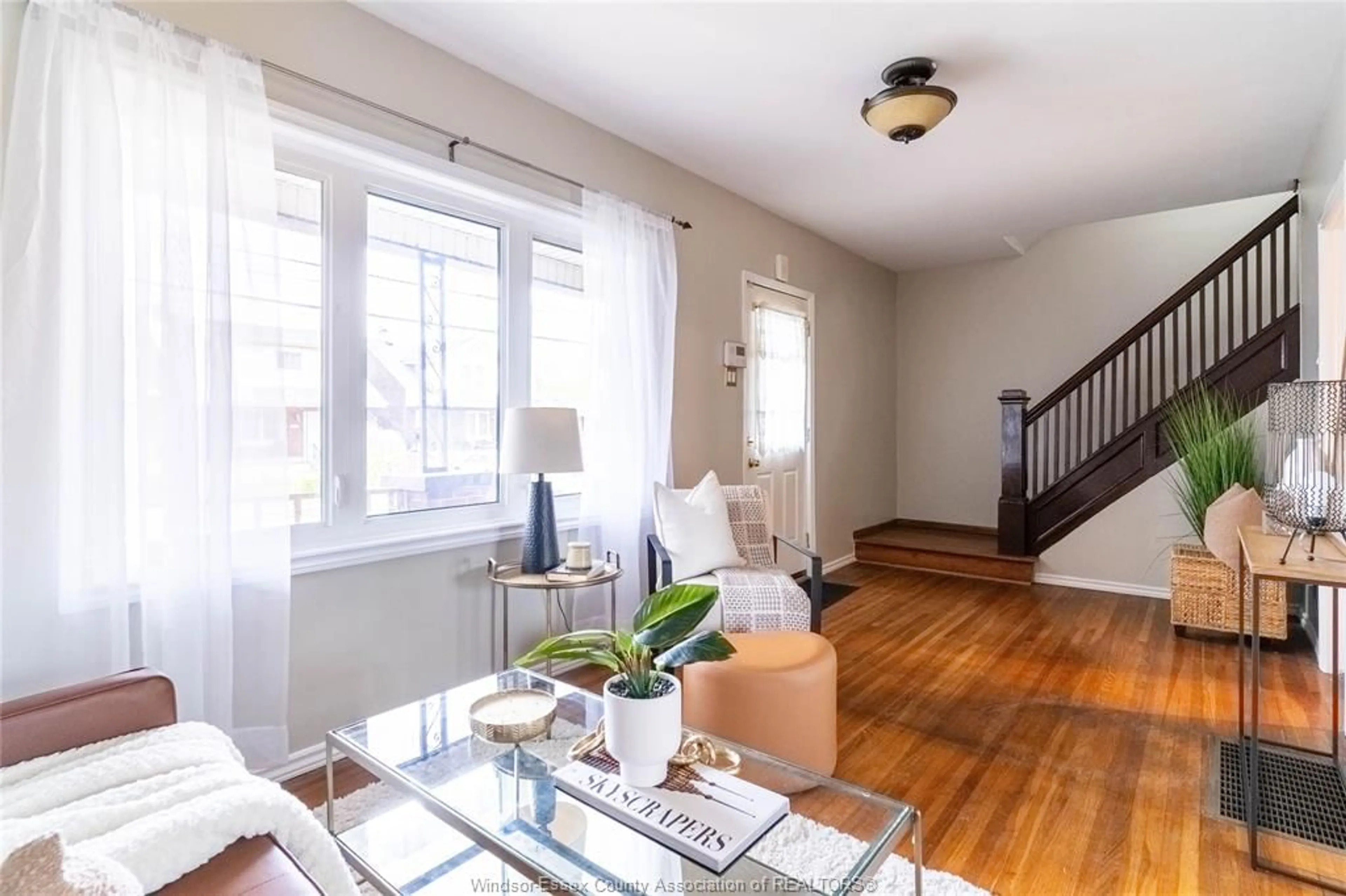 Living room with furniture, wood/laminate floor for 1161 Elm, Windsor Ontario N9A 3J1