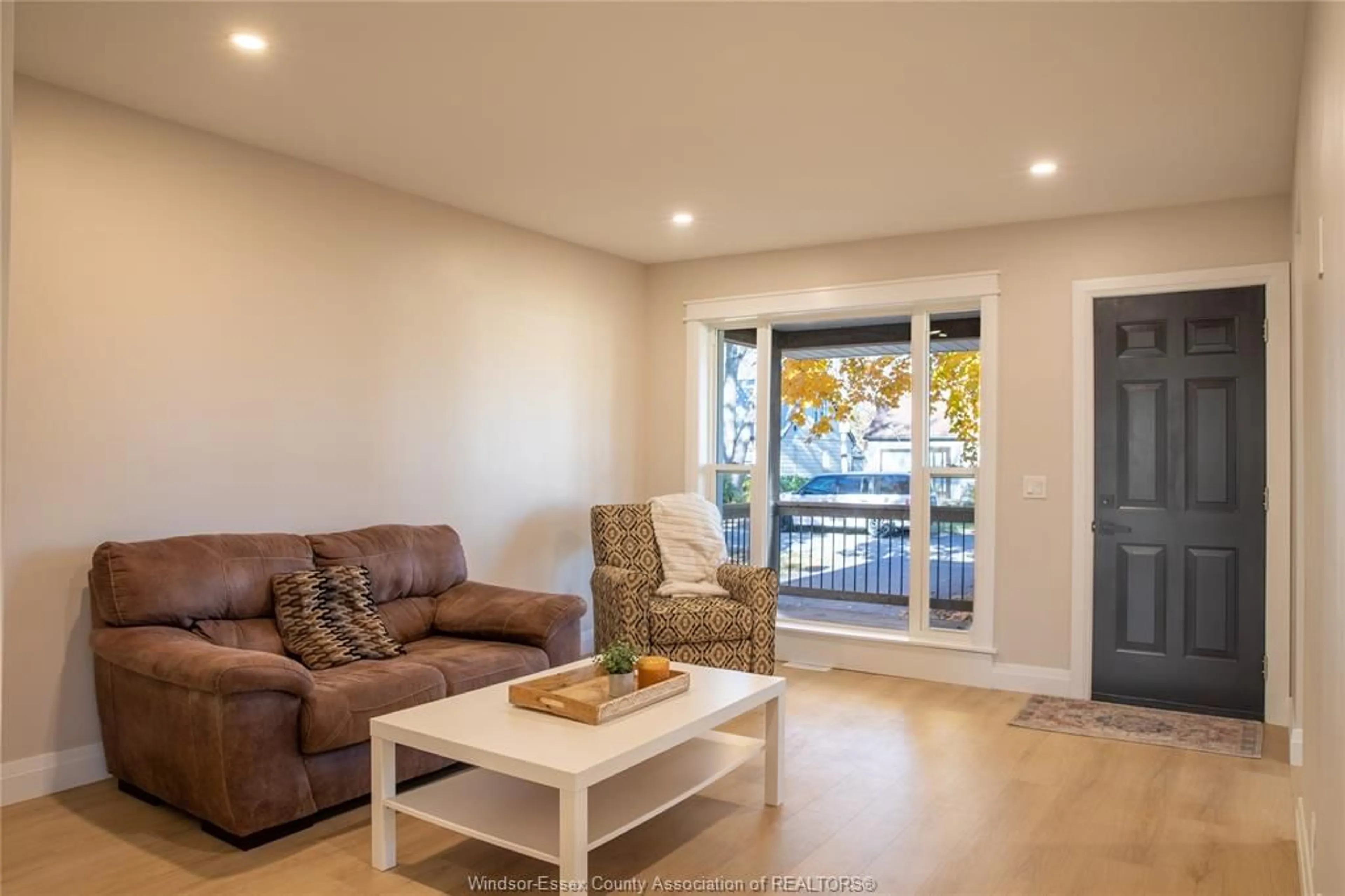 Living room with furniture, wood/laminate floor for 737 CHARLES St, Windsor Ontario N8X 3G7