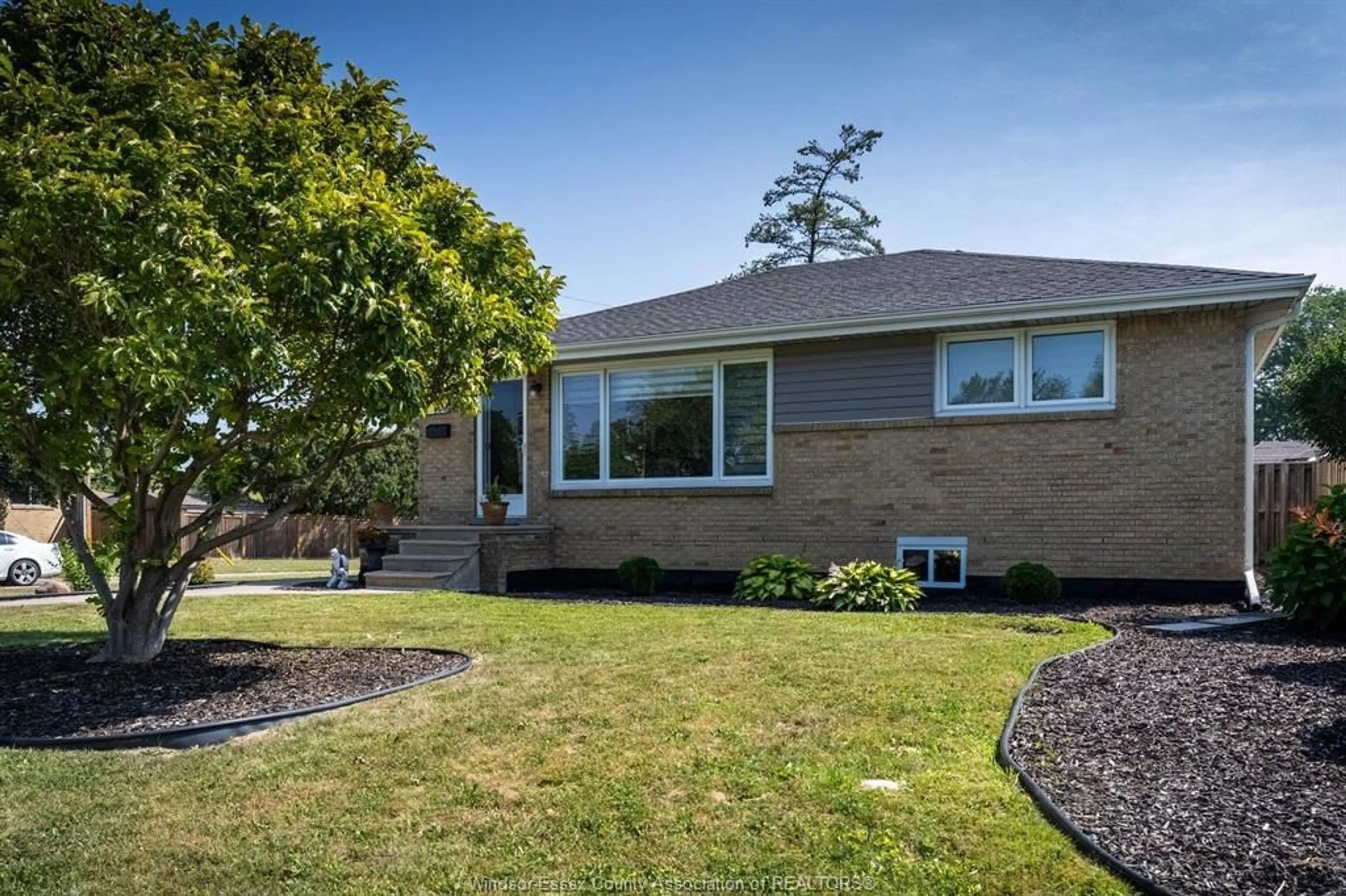 Home with brick exterior material, street for 1006 BUCKINGHAM Rd, Windsor Ontario N8S 2E3