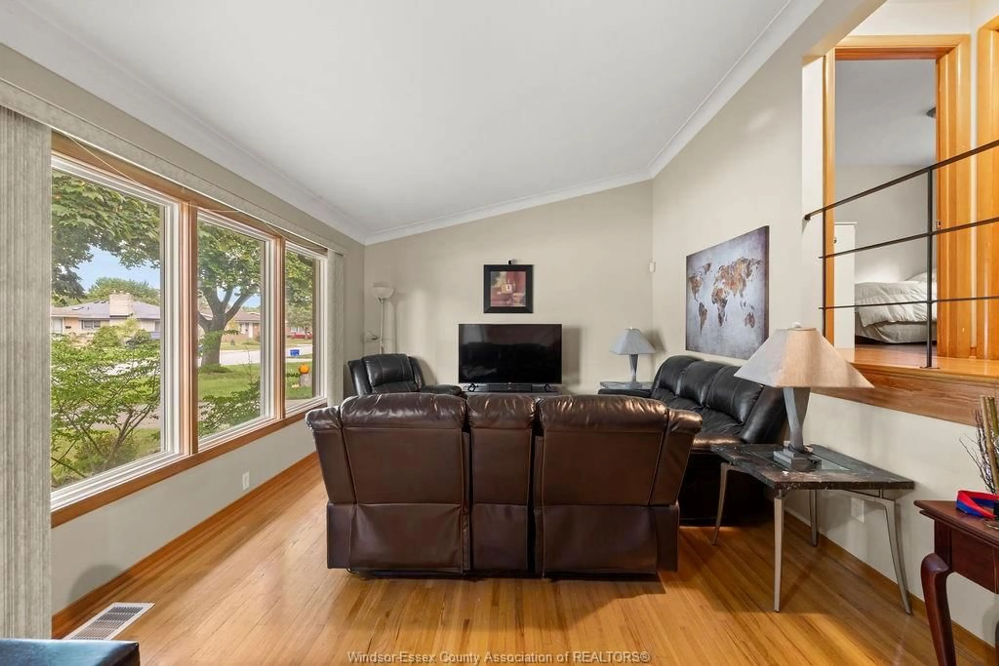 Living room with furniture, wood/laminate floor for 2584 GAIL, Windsor Ontario N8W 2Z6