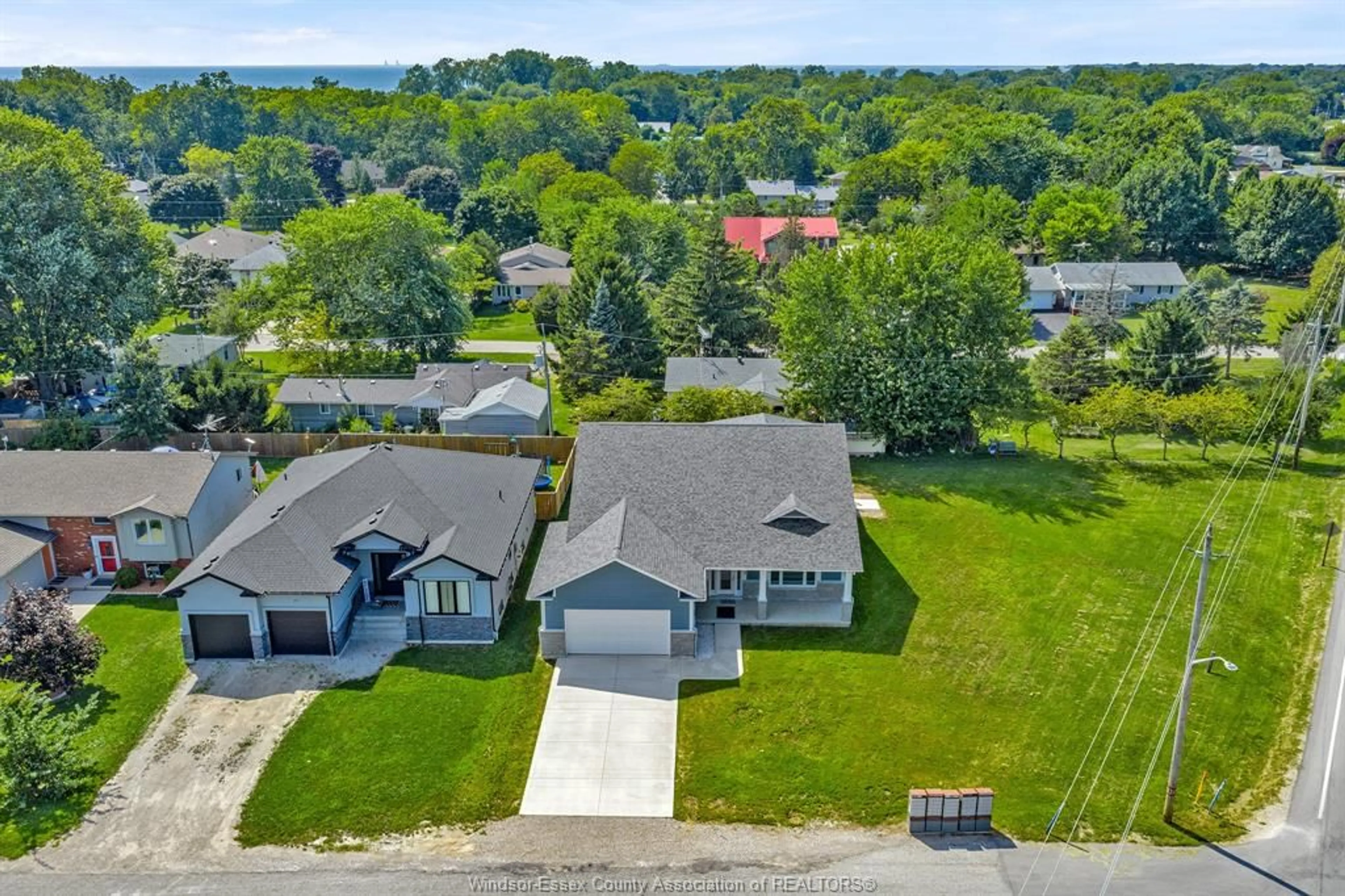 A pic from outside/outdoor area/front of a property/back of a property/a pic from drone, water/lake/river/ocean view for 157 GLOUCESTER Dr, Essex Ontario N0R 1G0